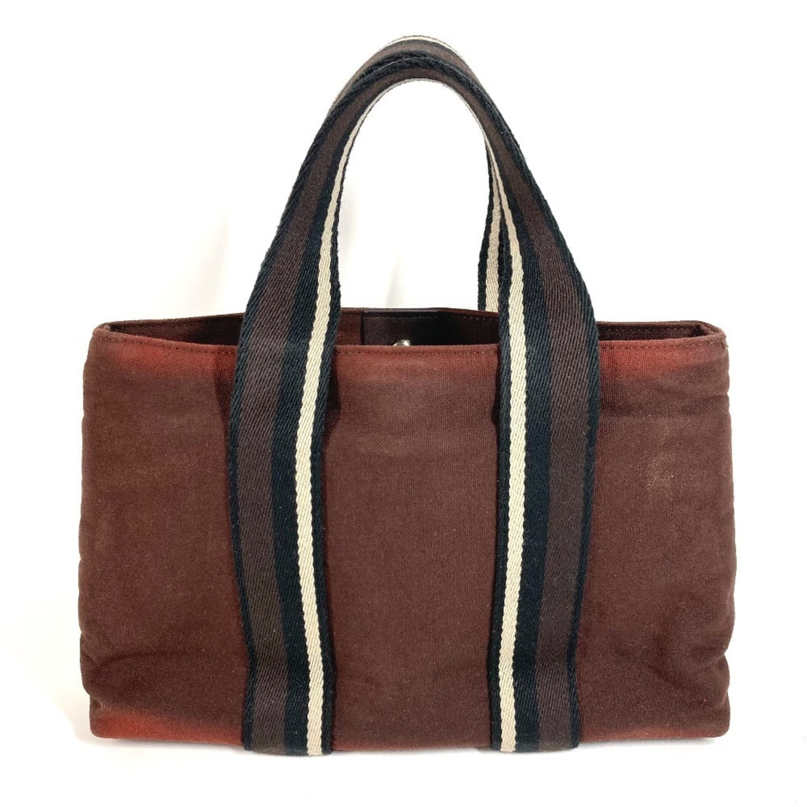 Cotton Handbag Tote Bag by Hermes: Cotton Handbag Tote Bag by Hermes Cotton Handbag Tote Bag by Hermes - A stylish and practical tote bag made from high-quality cotton, featuring a classic brown color. Measuring 19.5cm x 30cm x 8cm, it