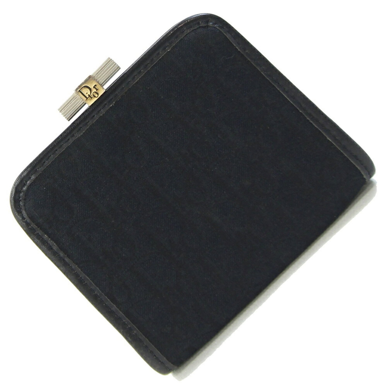 Christian Dior Coin Case Canvas Leather: Christian Dior Coin Case Canvas Leather Canvas and leather come together in sleek black design, defining the Trotter collection from Christian Dior. This coin case measures 8.5cm x 10cm and bears a