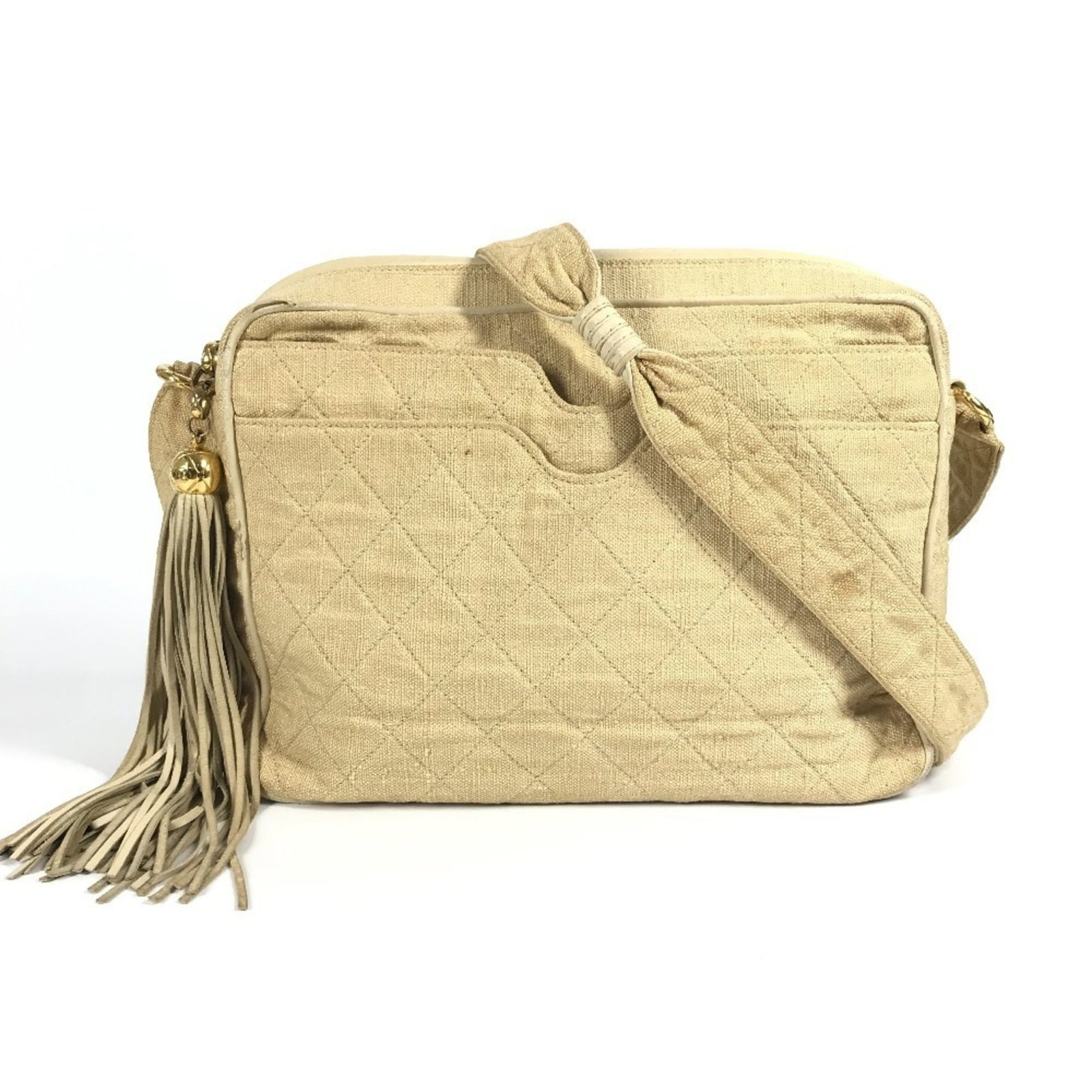 Shoulder bag canvas by Chanel: Shoulder bag canvas by Chanel Canvas by Chanel, a classic shoulder bag from the Matelasse line, features a timeless beige color and clean design. Made from high-quality canvas material, its compact