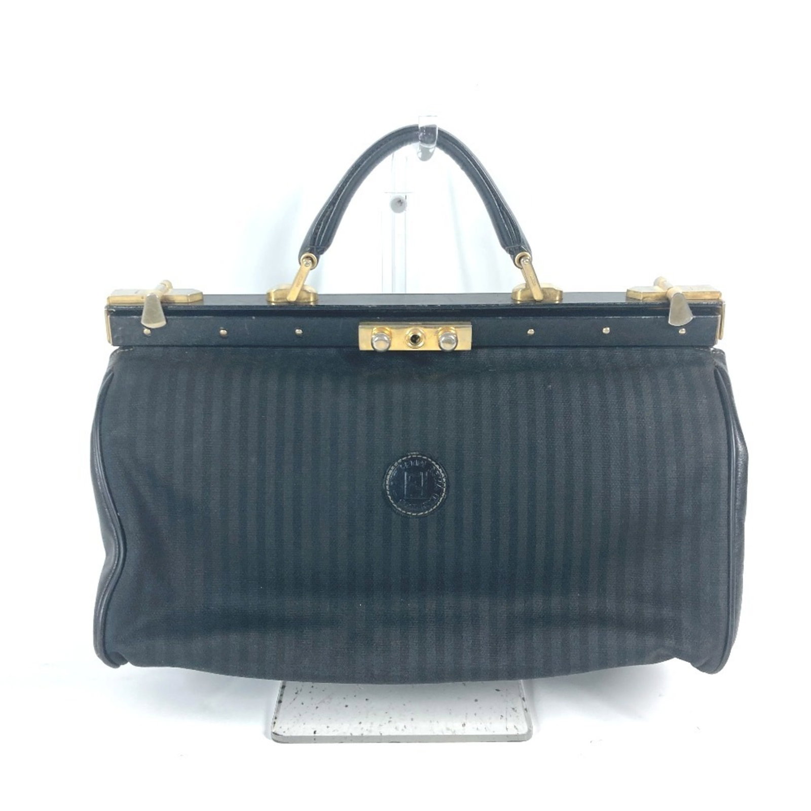 Fendi Handbag Leather Pvc: Fendi Handbag Leather Pvc The Fendi Doctor Bag Pecan in black features a unique blend of leather and PVC materials, offering a distinctive look. This stylish handbag boasts an open pocket and zipper p