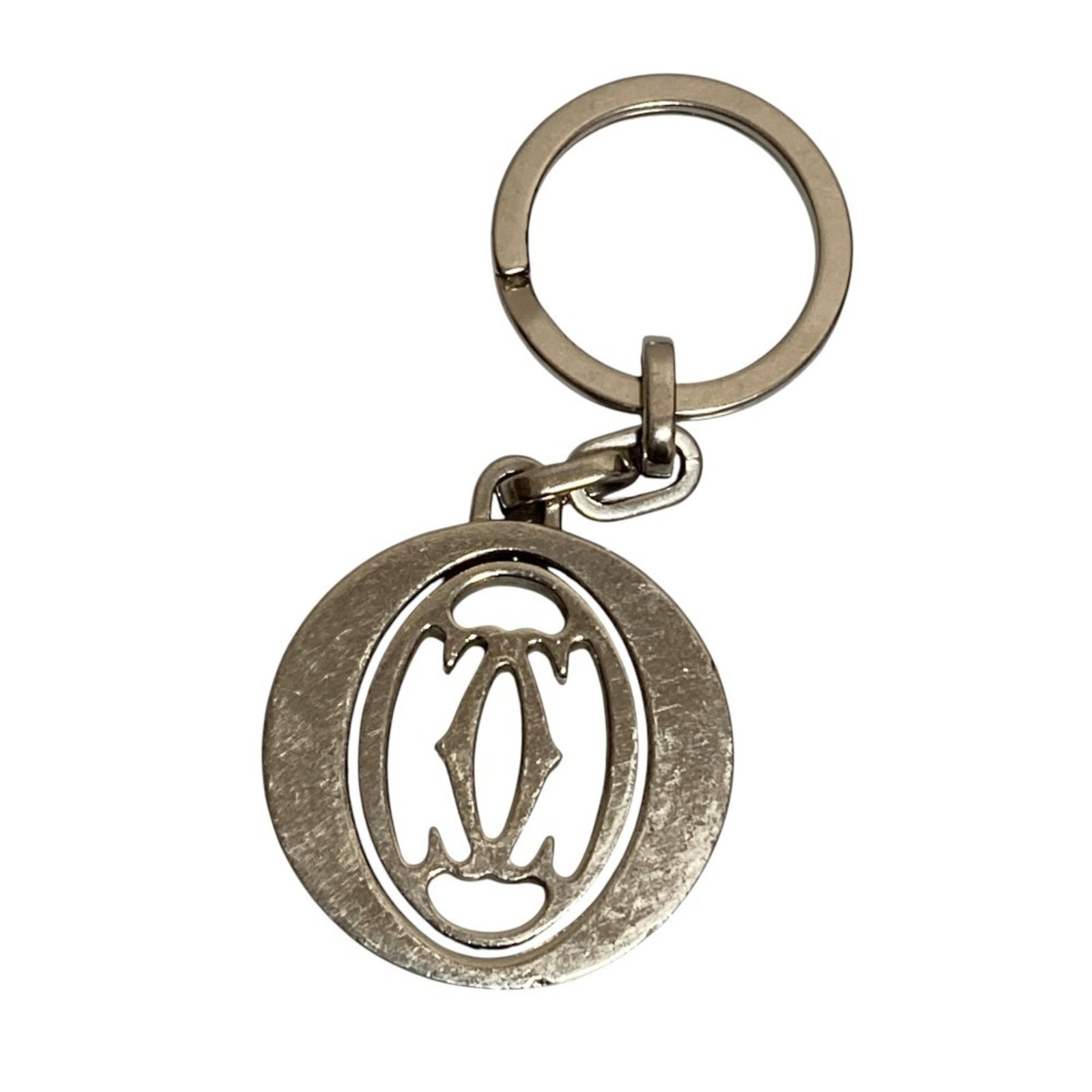 Keyring of Cartier: Keyring of Cartier Cartier keyring with sleek silver design, measuring 8.4cm x 3.5cm x 0.19cm in size. The item bears a signature, adding an air of elegance to its minimalist form. Its understated pre