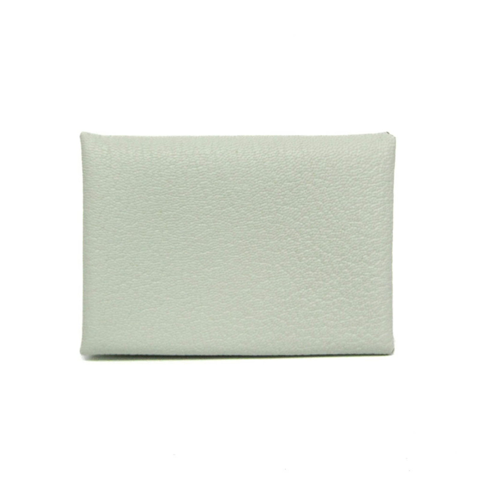 Chevre leather card case by Hermes: Chevre leather card case by Hermes Light green chevre leather wraps around the Calvi Duo card case, adding a touch of elegance to everyday essentials. The snap fastener closure and button pocket provi