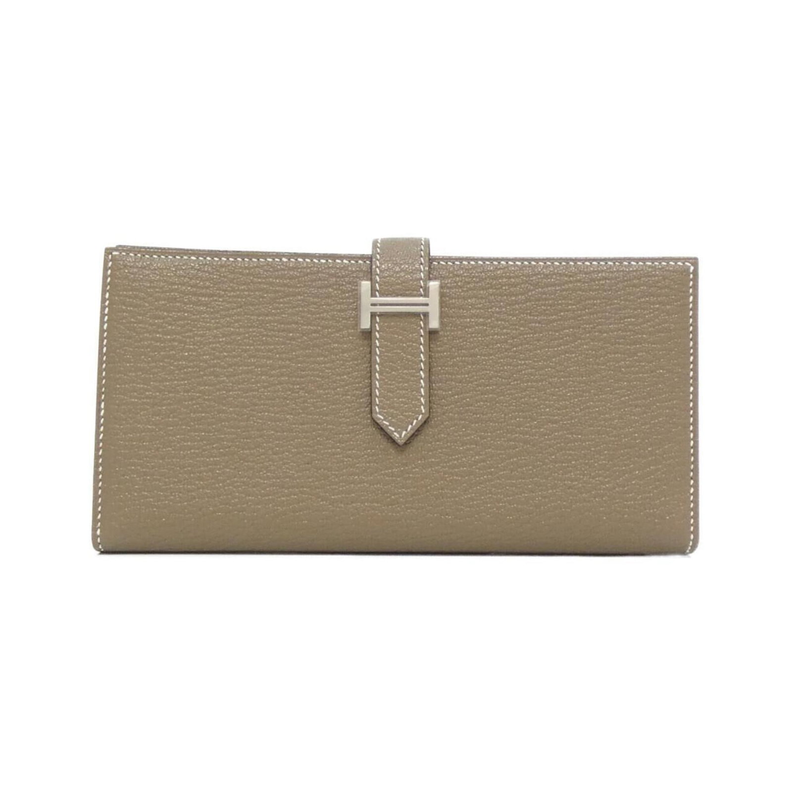 Chevre Leather Bi Fold Wallet Hermes: Chevre Leather Bi Fold Wallet Hermes Etoupe gray chevre leather adds a touch of sophistication to this bi-fold wallet, measuring 9cm x 18cm x 2cm. The unique long design provides ample space for cards