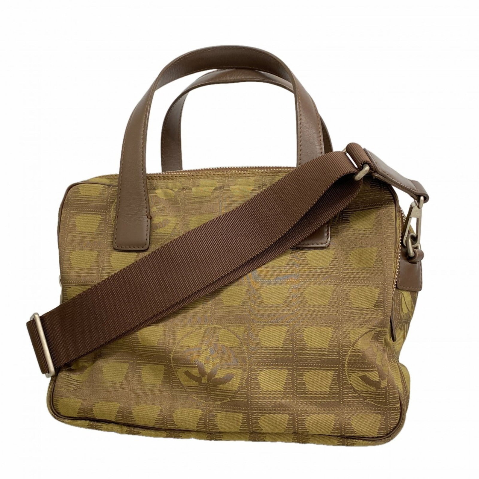 Nylon handbag by Chanel: Nylon handbag by Chanel Nylon handbag by Chanel features a khaki color and silver hardware, with dimensions of 19cm x 25cm x 9.5cm. This compact bag boasts a classic design that showcases the iconic