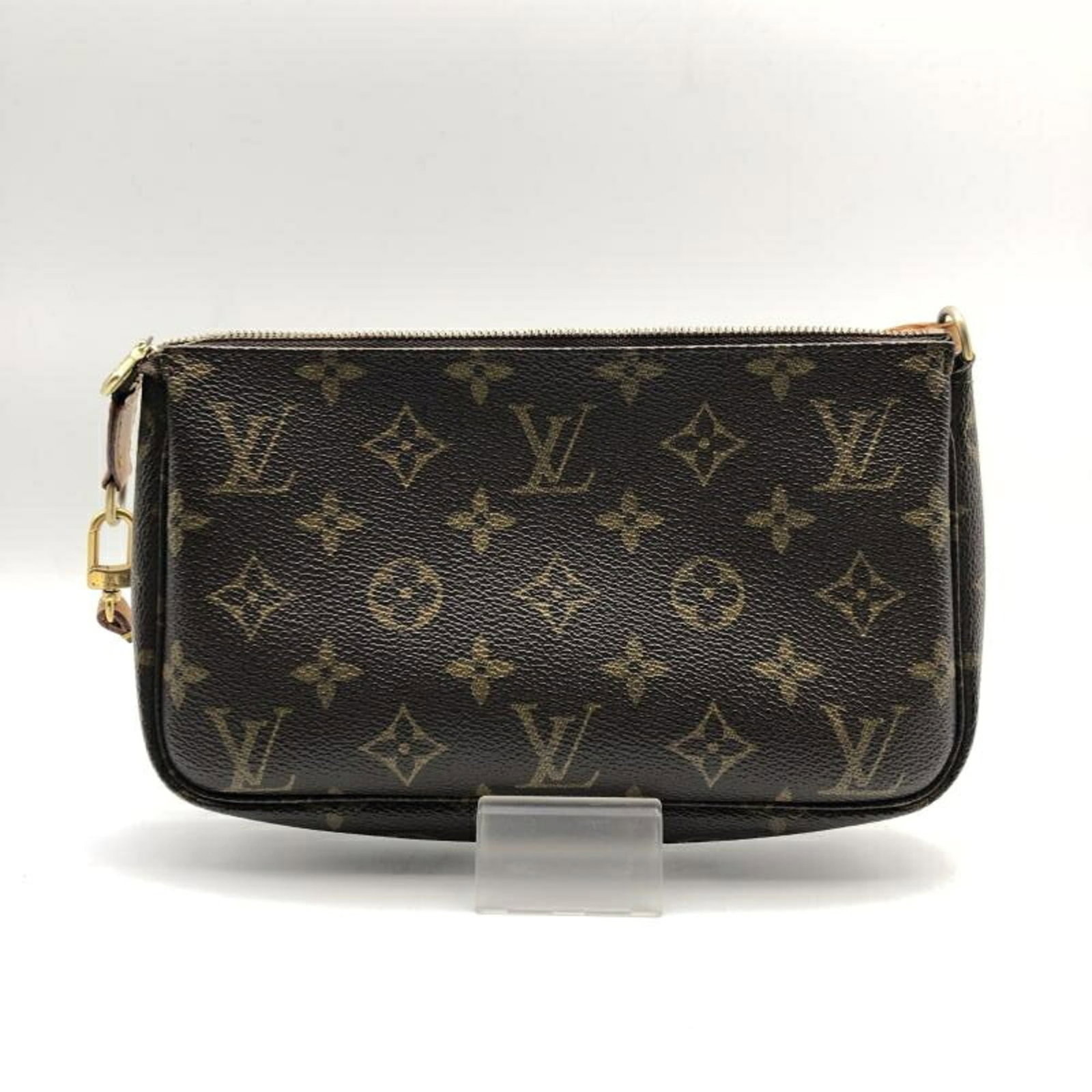 Louis Vuitton Handbag Pochette: Louis Vuitton Handbag Pochette Brown Louis Vuitton Pochette Handbag. This pochette features the classic brown monogram pattern, measuring 11cm x 21cm x 3cm. A stylish and compact accessory from a reno