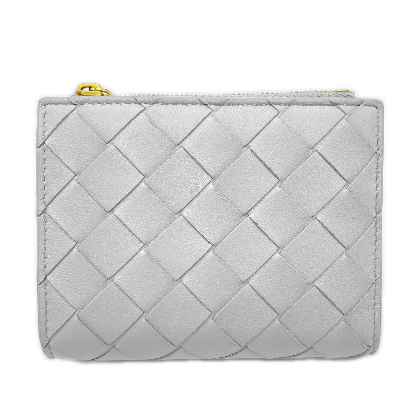 Veneta Bottega Bi Fold Leather Wallet: Veneta Bottega Bi Fold Leather Wallet The Veneta Bottega Bi Fold Leather Wallet boasts sleek, sophisticated design with its gray lambskin material and classic bi-fold layout. Measuring just 9cm x 11.5