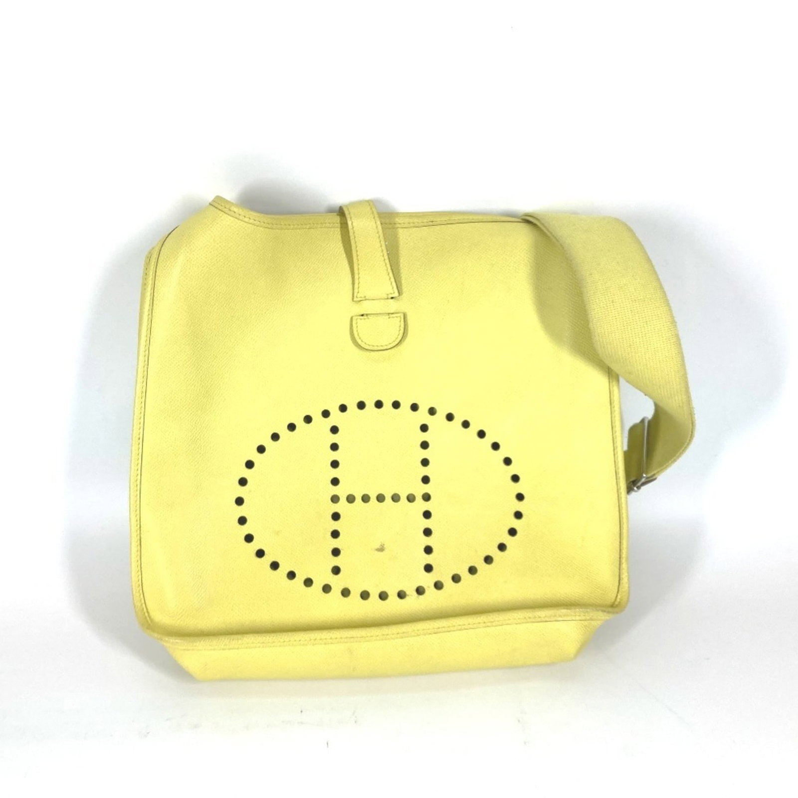 Hermes Shoulder Bag Epsom Leather: Hermes Shoulder Bag Epsom Leather Epsom leather provides a unique texture to this shoulder bag, while the lime and lime yellow color combination adds a pop of vibrant hue. The snap pocket and belt clo