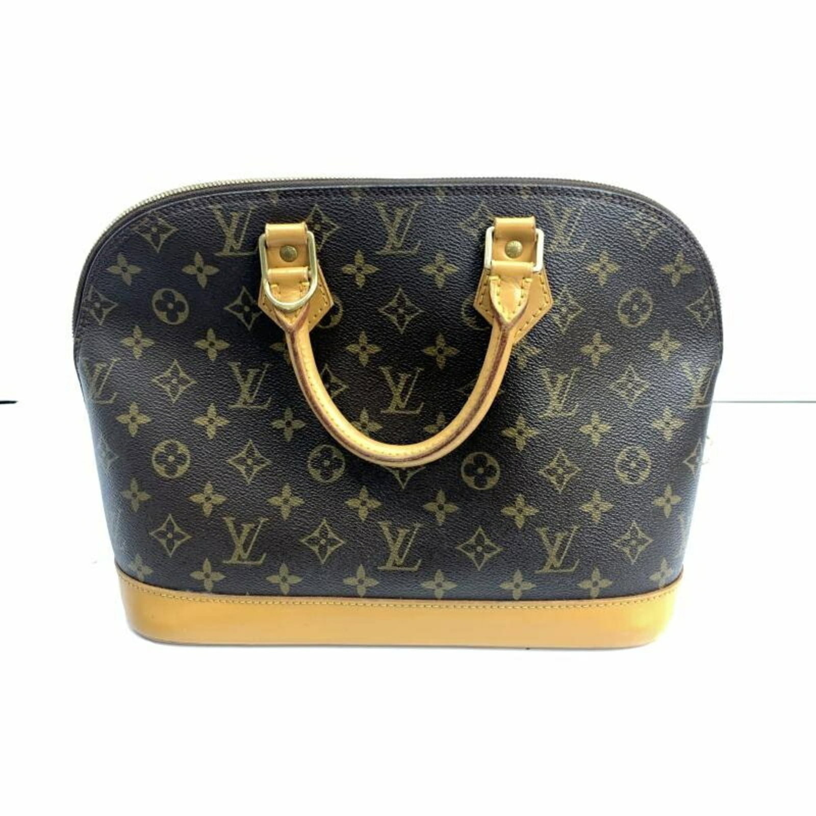 Louis Vuitton Handbag: Louis Vuitton Handbag Louis Vuitton's iconic handbag boasts classic design and timeless elegance, with its signature monogram pattern and spacious interior. Measuring 23.5cm x 30.5cm x 16cm, it provid