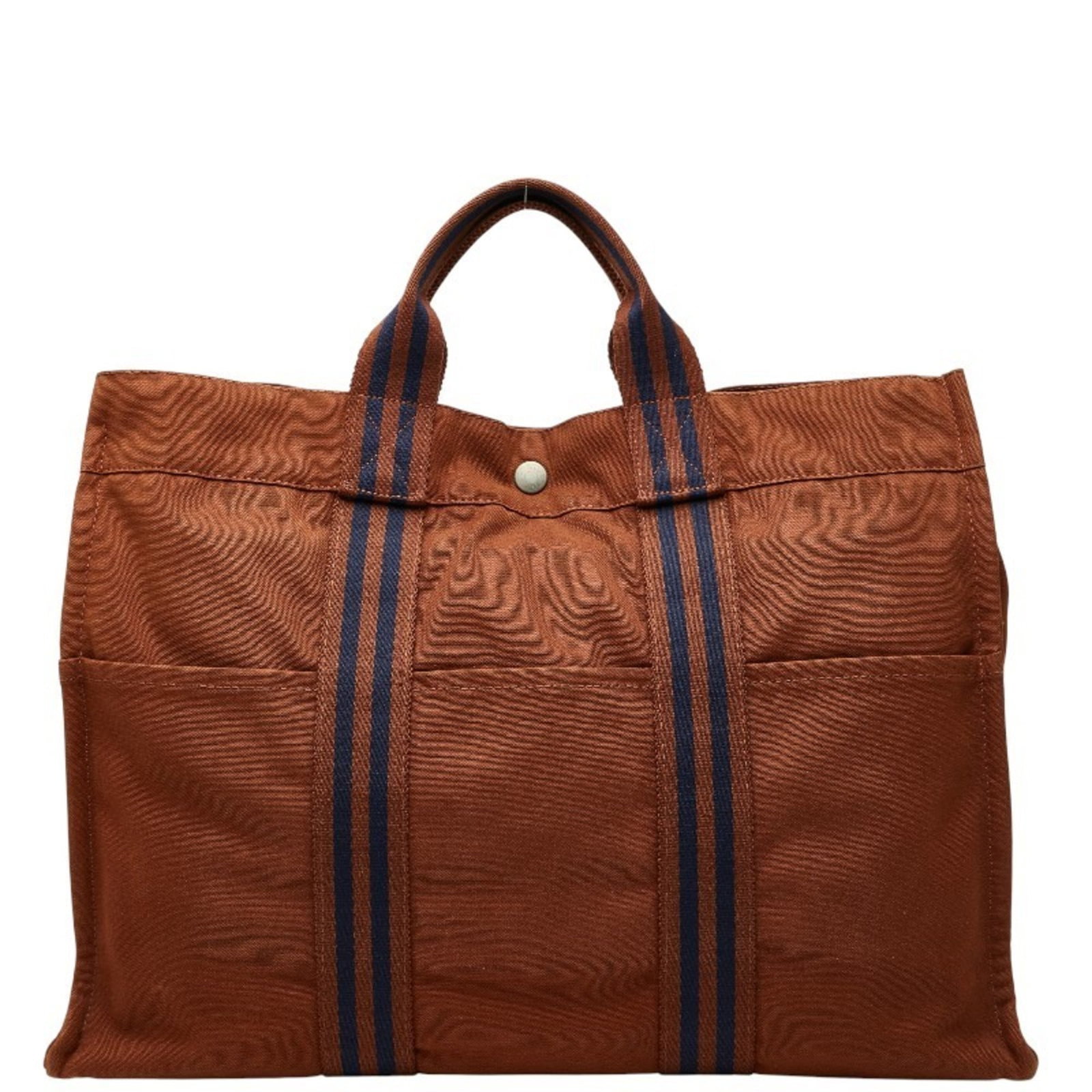 Canvas Hermes Tote Bag: Canvas Hermes Tote Bag Brown and navy canvas tote bag from Hermes, measuring 32cm x 42cm x 11cm. This classic design showcases the brand's signature style with clean lines and a timeless silhouette. T