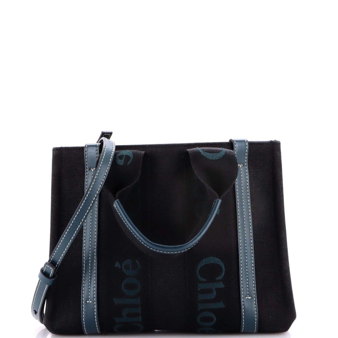 Small canvas tote leather Chloe Woody: Small canvas tote leather Chloe Woody Small canvas tote leather Chloe Woody in black exterior with neutral interior, featuring gold tone hardware and minor wear on handles and straps. This very good