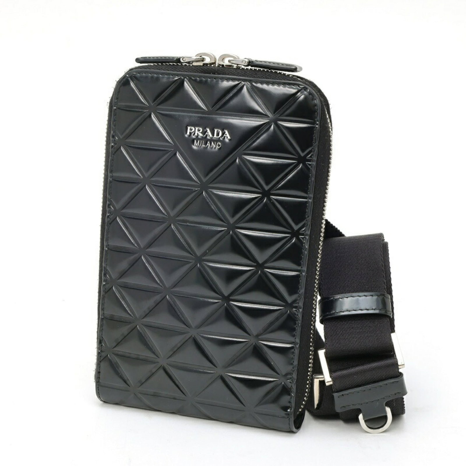 Patent Leather Prada Pouch: Patent Leather Prada Pouch Patent leather Prada Pouch in black features a sleek design with a signature. Made from high-quality patent leather, its glossy finish adds a touch of sophistication.