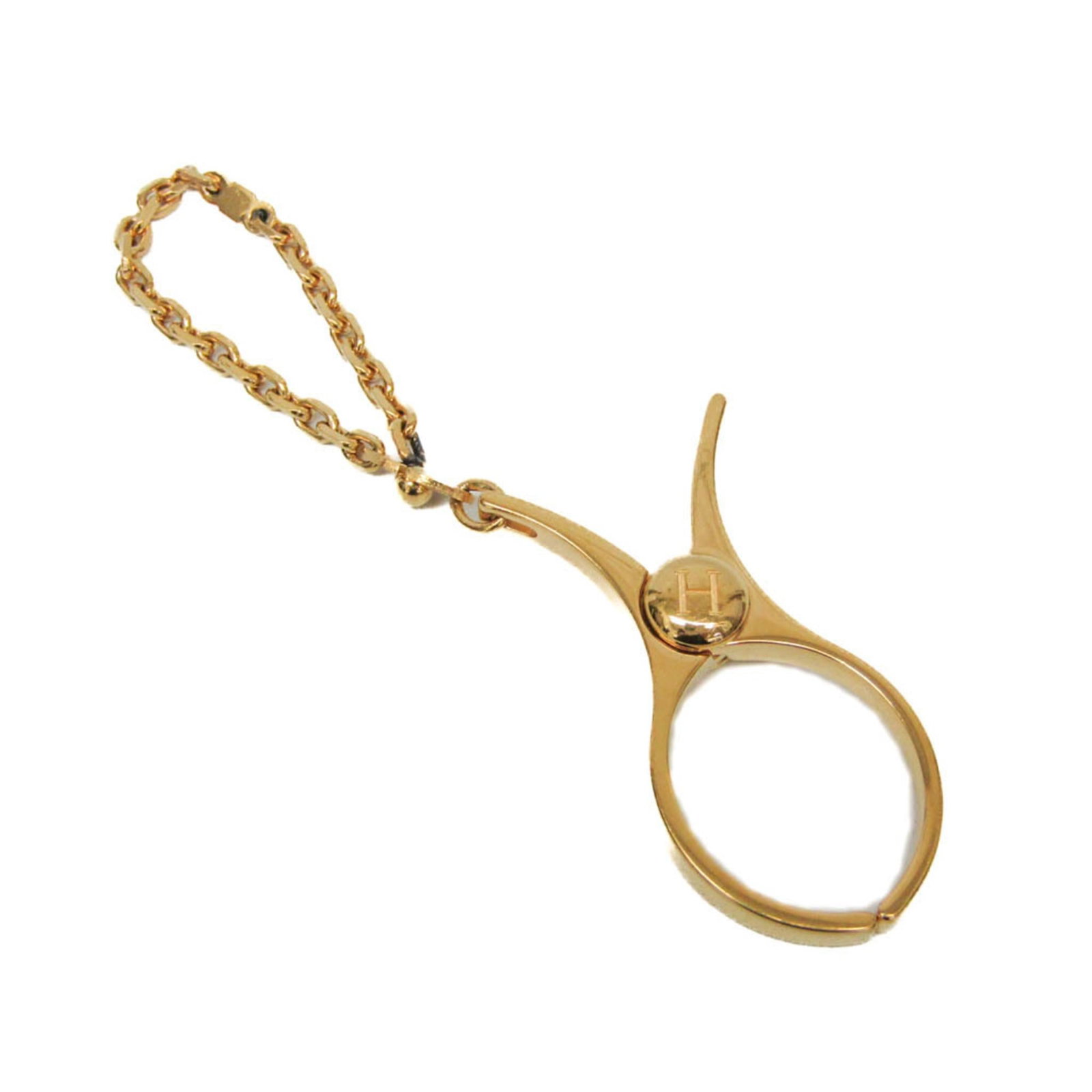 Glove Holder Metal By Hermes: Glove Holder Metal By Hermes Gold Glove Holder by Hermes features a sleek metal design with adjustable strap length, perfect for holding gloves in style. Made from durable metal, this compact accessor