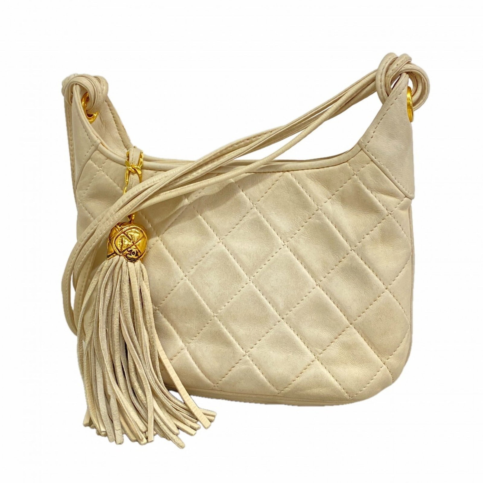 Shoulder Bag Leather Chanel: Shoulder Bag Leather Chanel White lambskin leather shoulder bag with gold hardware, featuring a classic Chanel design. The bag measures 12.5cm x 16cm x 7cm and has a sleek, compact shape. Made from