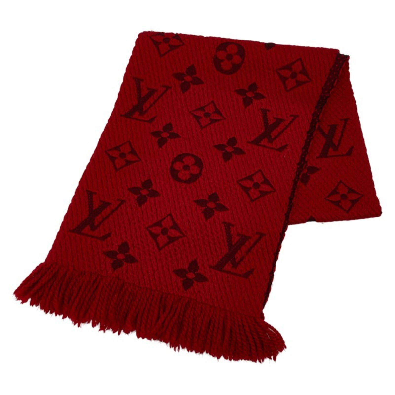 Silk stole by Louis Vuitton: Silk stole by Louis Vuitton Silk stole by Louis Vuitton in vibrant red, measuring 1.7m x 31.5cm, presented in a luxurious box. The stole features a striking combination of wool and silk materials. A b