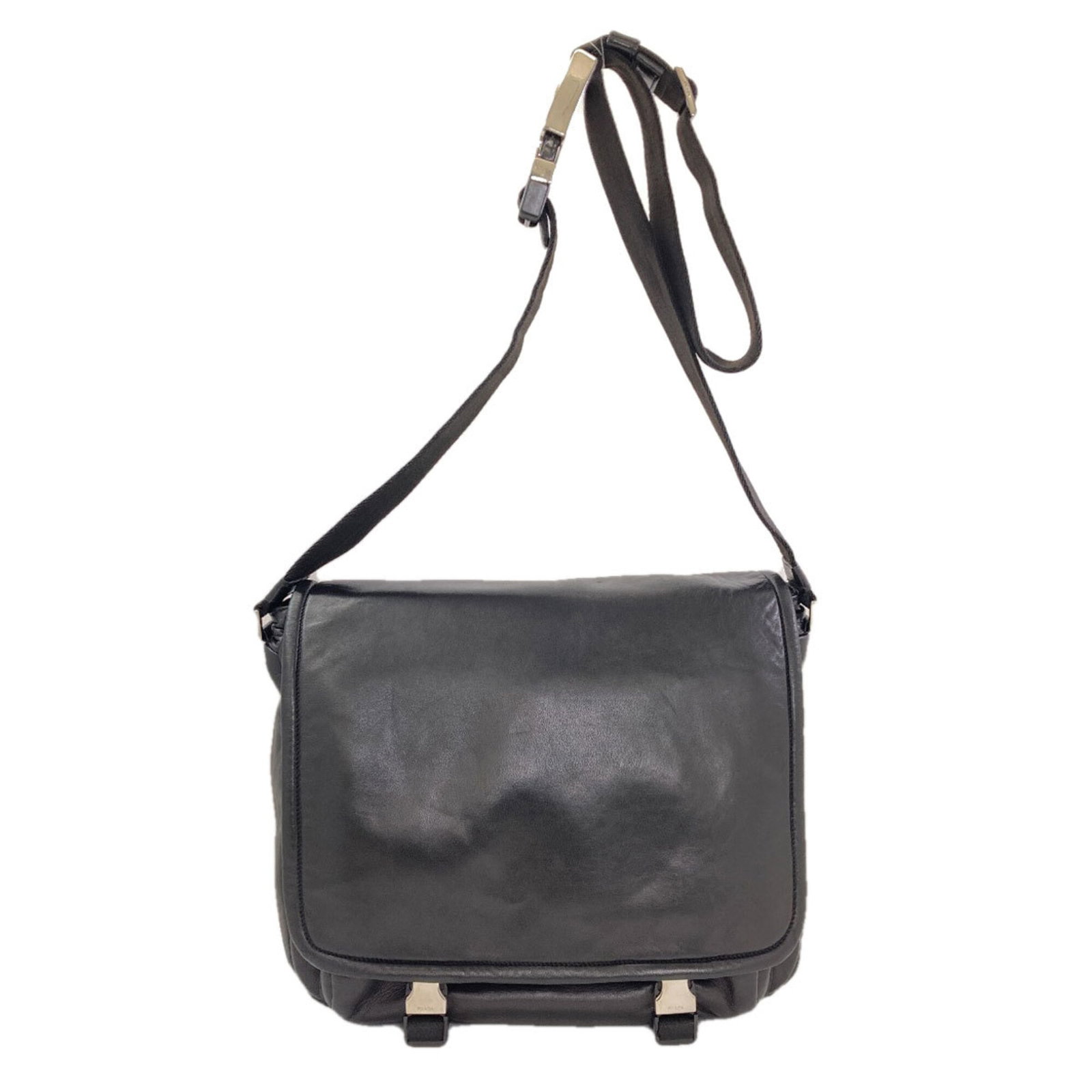 Shoulder Bag Leather by Prada: Shoulder Bag Leather by Prada Prada's black leather shoulder bag boasts sleek lines and a sophisticated design, crafted from high-quality lambskin. Measuring 29cm x 36cm x 13cm, it features adjustable