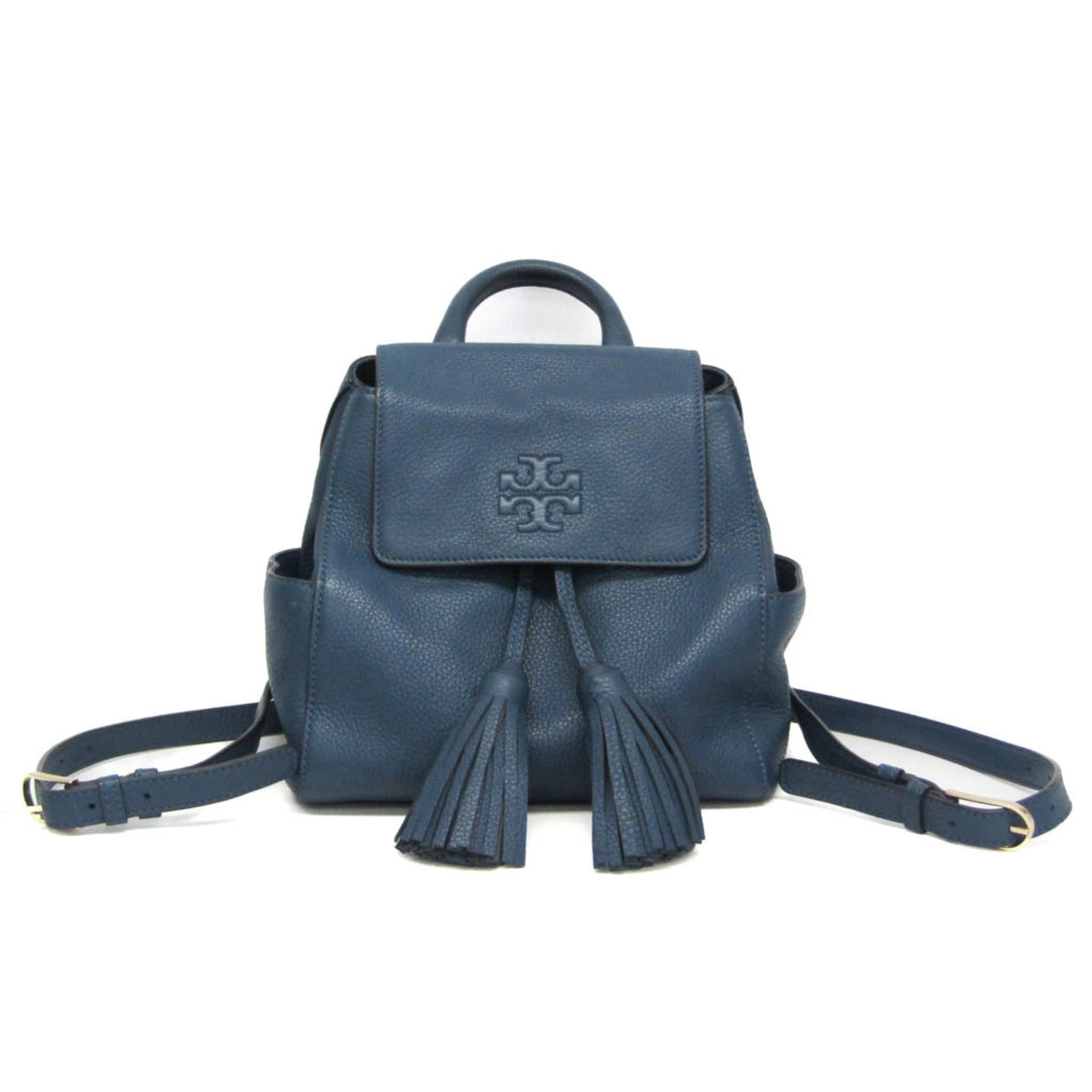 Backpack Leather by Tory Burch: Backpack Leather by Tory Burch Tory Burch's iconic Fringe backpack is crafted from high-quality leather, featuring a chic blue hue and functional details like a belt closure, zipper pocket, and open