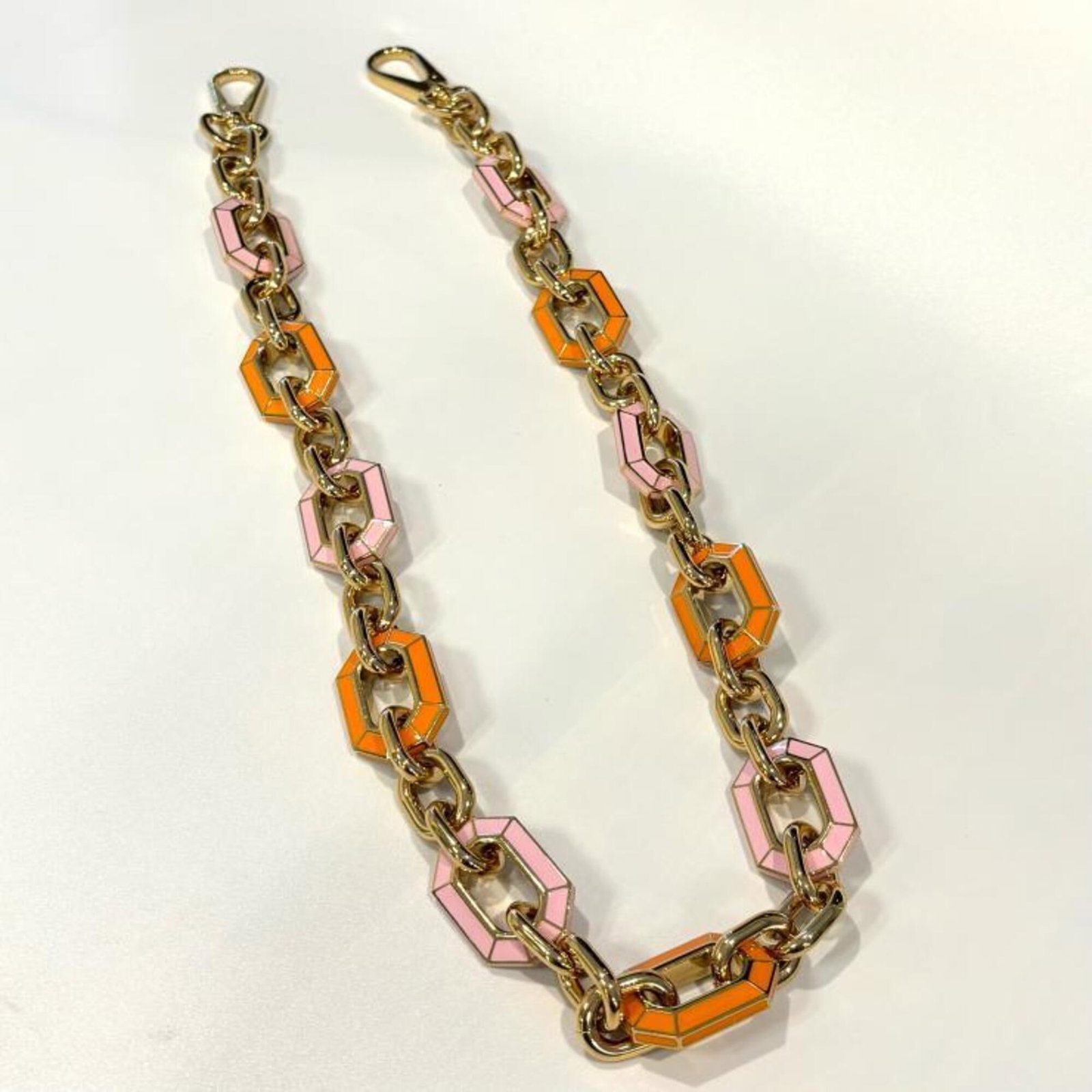 Strap from Louis Vuitton: Strap from Louis Vuitton Strap from Louis Vuitton, available in gold, orange, and pink. Notable for its distinctive color options, this strap features the iconic brand's signature style. Made by Louis