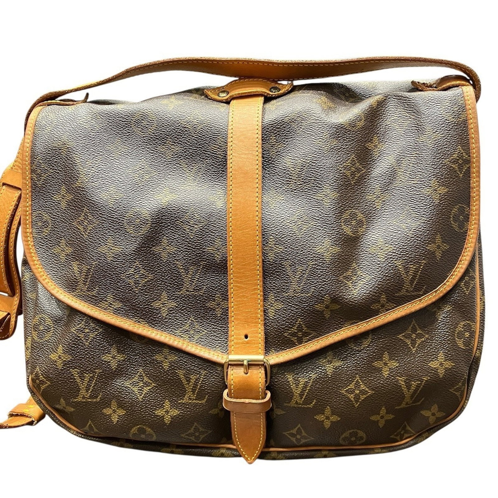 Shoulder Bag Monogram By Louis Vuitton: Shoulder Bag Monogram By Louis Vuitton Monogrammed luxury at its finest, this Louis Vuitton shoulder bag boasts the iconic monogram pattern in rich brown tones. With a sturdy design and adjustable str