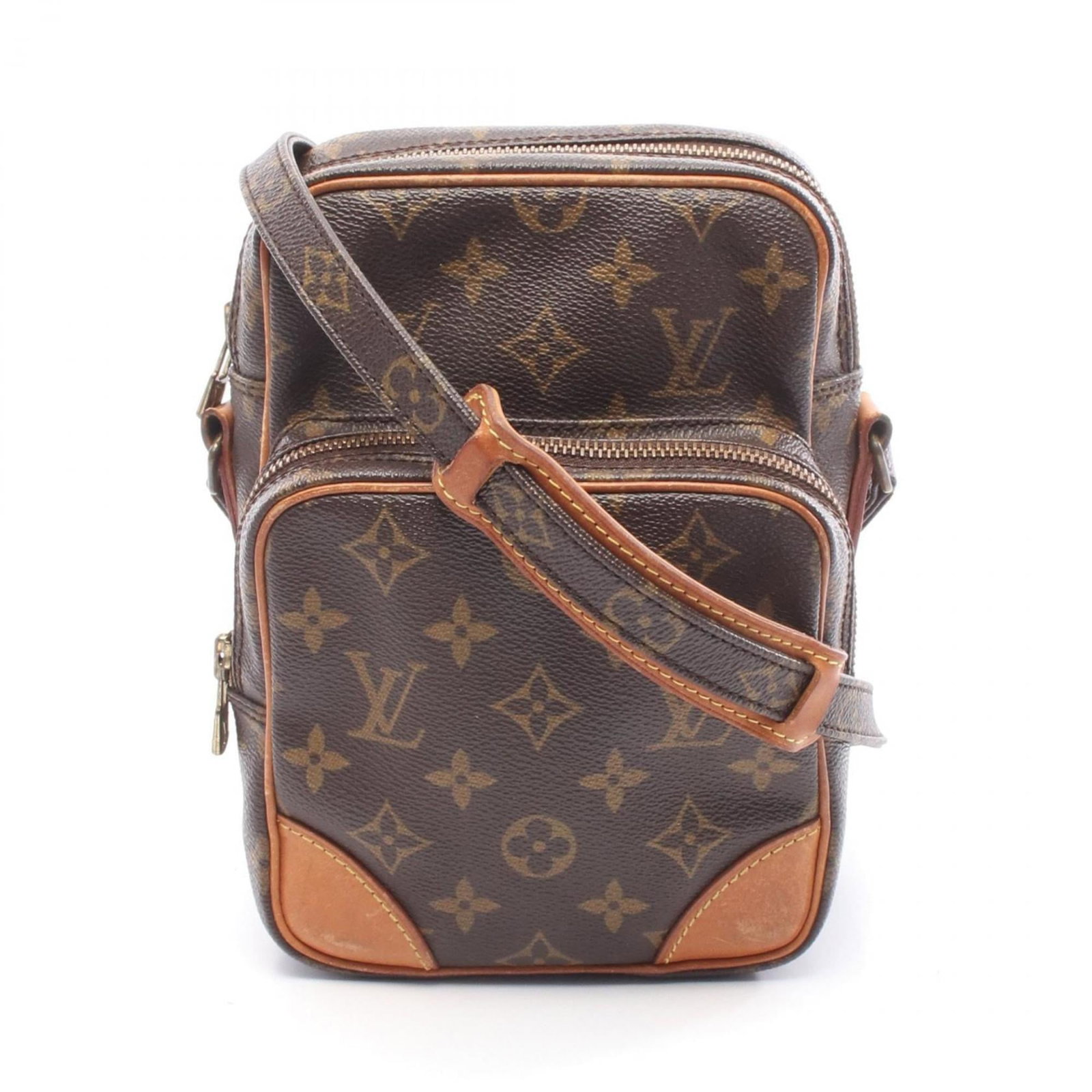 Canvas Leather coated shoulder bag from Louis Vuitton: Canvas Leather coated shoulder bag from Louis Vuitton Coated canvas and leather come together in this classic Louis Vuitton shoulder bag, crafted with a timeless brown hue. Measuring just 21cm x