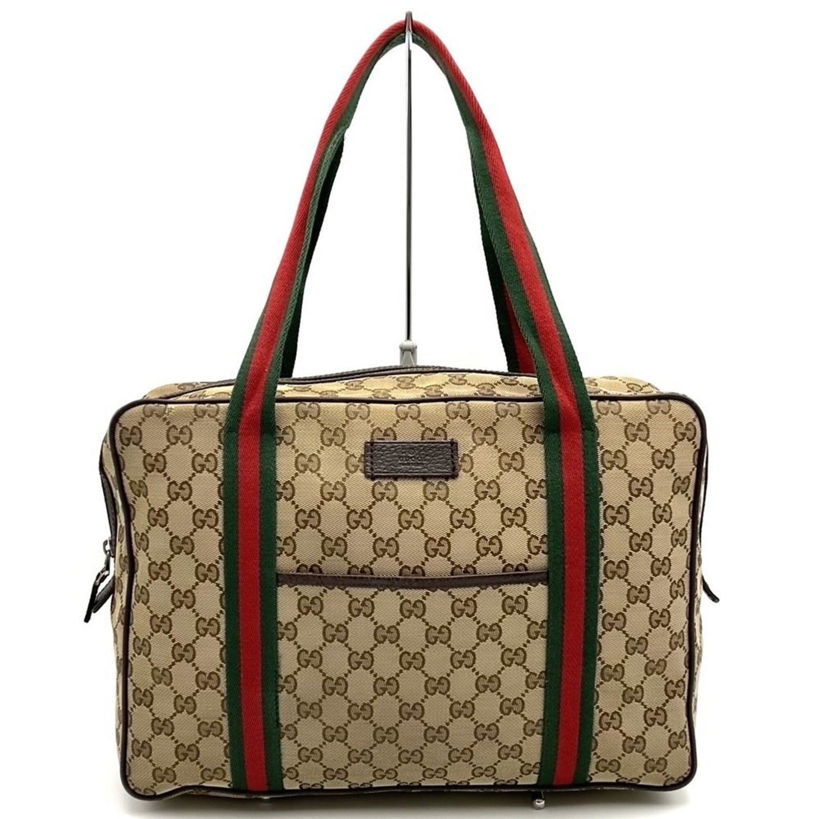 Canvas GG Bag Shoulder Tote Gucci: Canvas GG Bag Shoulder Tote Gucci The Gucci GG Canvas Shoulder Tote boasts a sturdy design with a signature GG canvas material, featuring a classic zipper closure and two open pockets for added