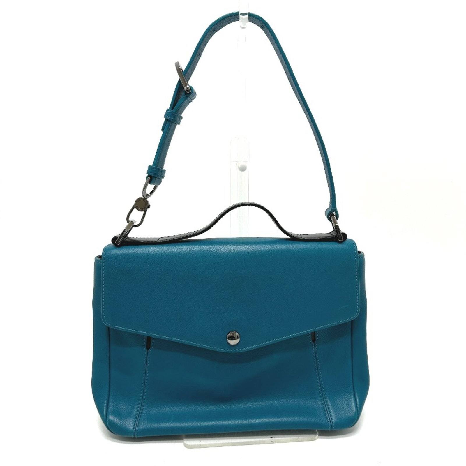 Bvlgari Handbag Leather: Bvlgari Handbag Leather Bvlgari Handbag Leather features a striking blue and turquoise color combination, showcasing the brand's signature style. Made from high-quality leather, this handbag boasts a 