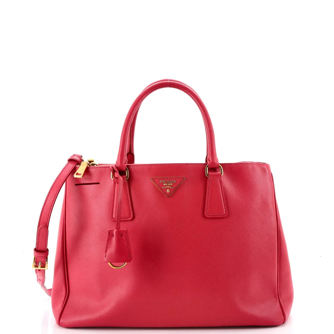 Lux Tote Saffiano Leather Medium double zip by Prada: Lux Tote Saffiano Leather Medium double zip by Prada Pink Saffiano Leather Lux Tote with Double Zip Closure, featuring heavy discoloration on handles and straps. This medium-sized tote measures 9.5"
