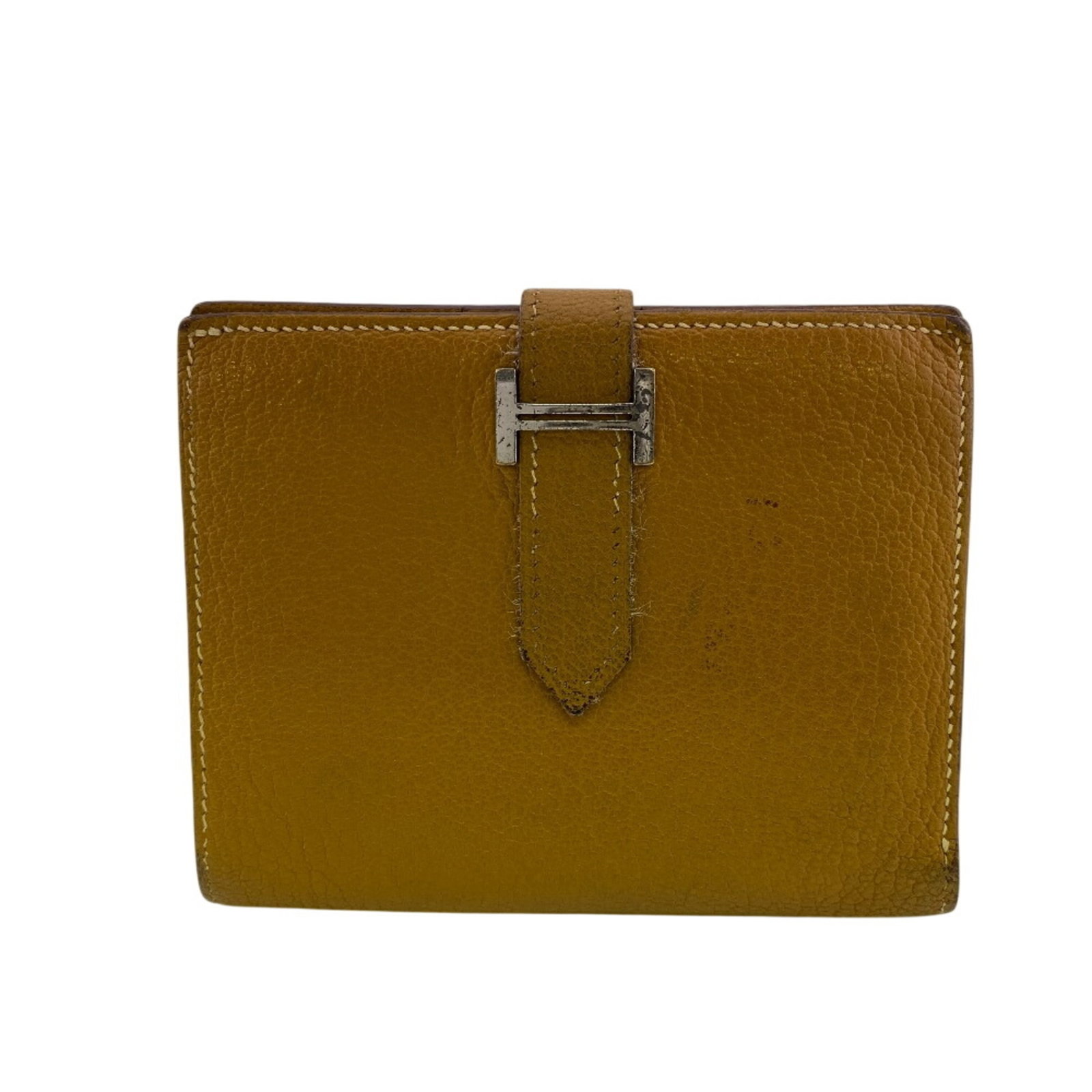 Leather Bi Fold Hermes Wallet: Leather Bi Fold Hermes Wallet Beige leather bi-fold wallet from Hermes, measuring 9.5cm x 12cm / 3.74'' x 4.72''. This classic design features high-quality leather construction and a timeless