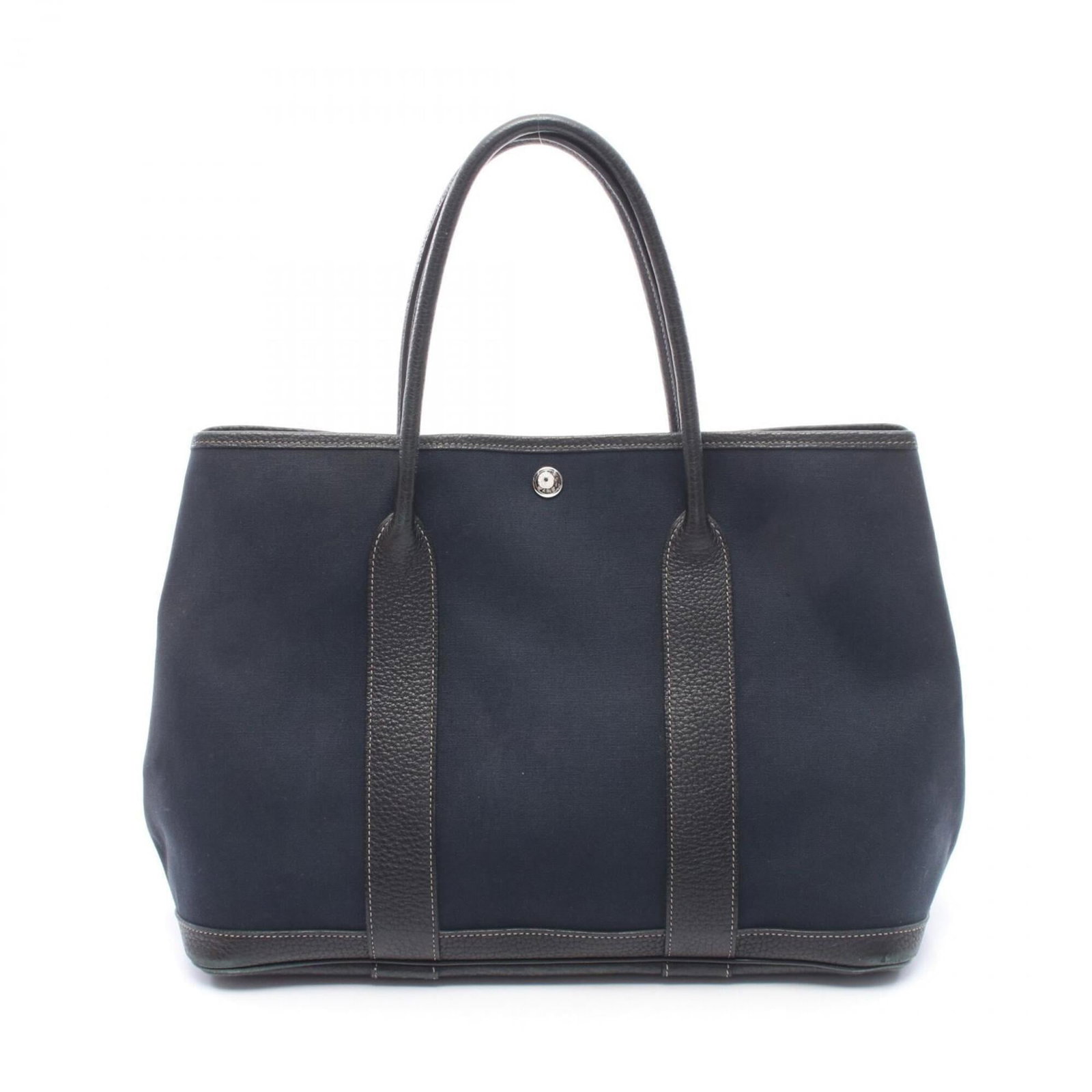 Handbag tote to leather canvas officier hermes bag: Handbag tote to leather canvas officier hermes bag Toile officier, leather, and canvas come together in this unique black tote bag from Hermes. Measuring 25cm x 36cm x 17cm, it offers a stylish and fu
