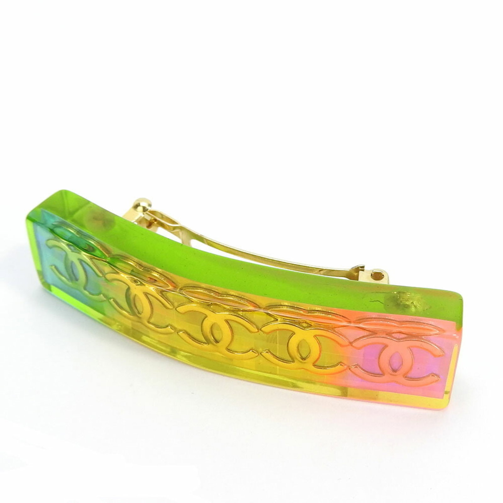 Barrette Plastic By Chanel: Barrette Plastic By Chanel Chanel's iconic barrette, crafted from durable plastic, boasts a vibrant multi-color design. Measuring 1.4cm x 6.2cm in size, it adds a playful touch to any hairstyle. A sty