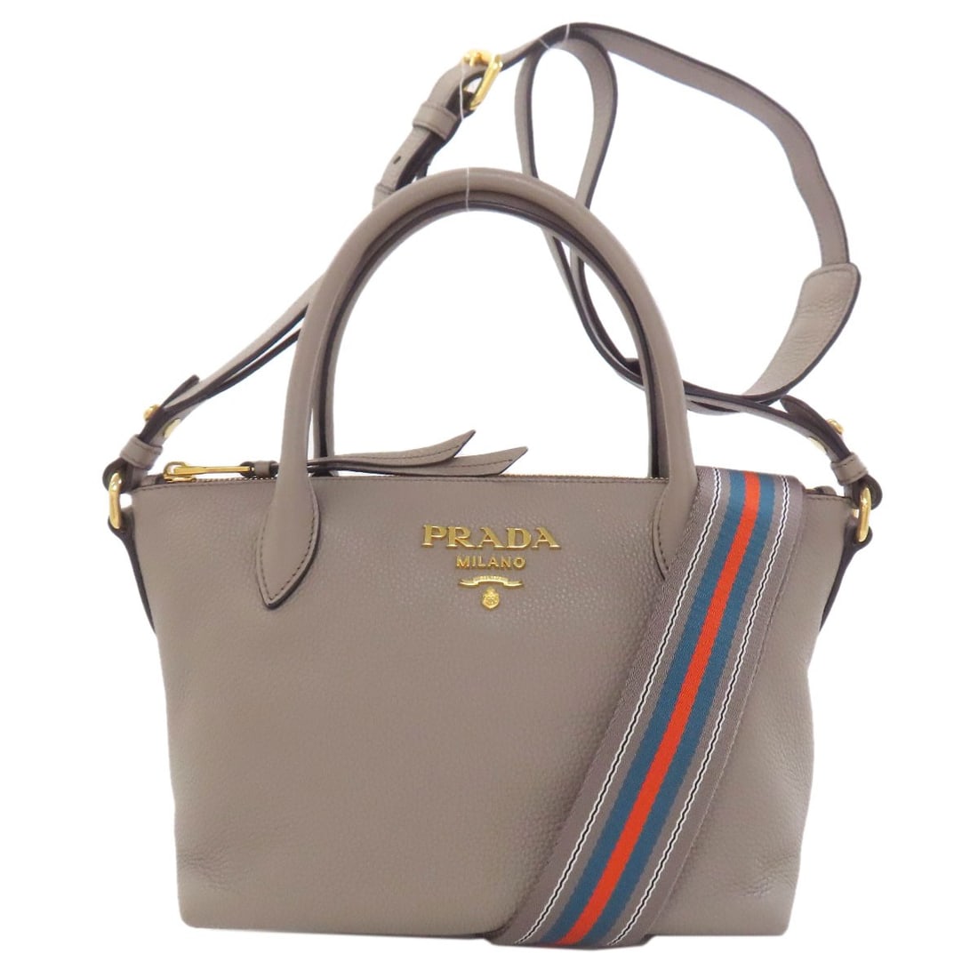 Prada 1Ba111 2Way Handbag Calf: Prada 1Ba111 2Way Handbag Calf The Prada 1Ba111 2Way Handbag boasts a sleek, gray calf exterior and a sophisticated design. This stylish handbag features a unique 2-way closure, allowing for multiple