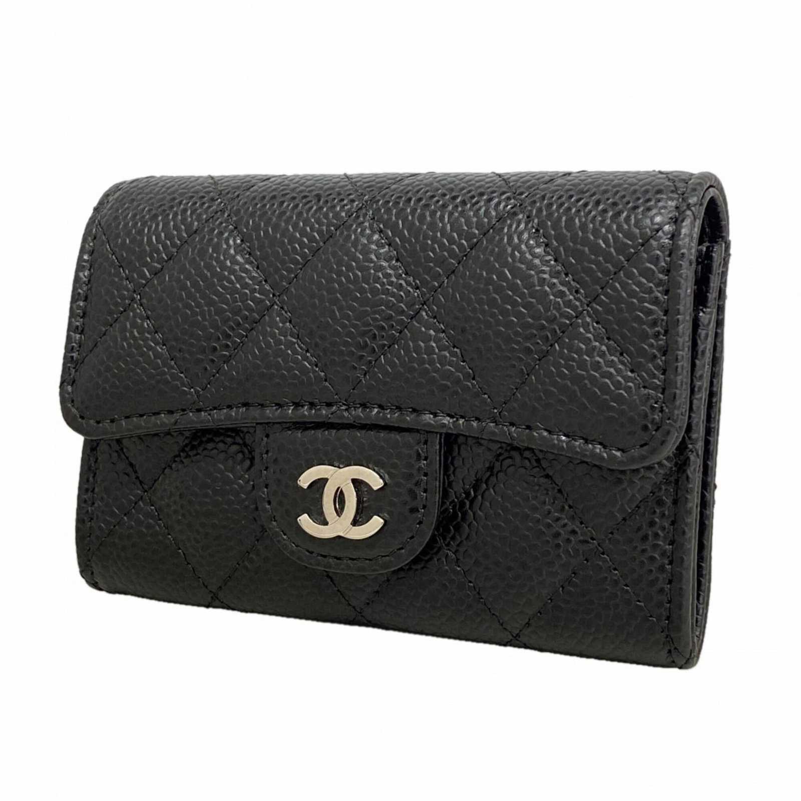 Calfskin card case by Chanel: Calfskin card case by Chanel Black Grained Calfskin Card Case by Chanel, measuring 8cm x 11cm x 2cm. Made from high-quality calfskin material, this card case features a sleek and sophisticated design 