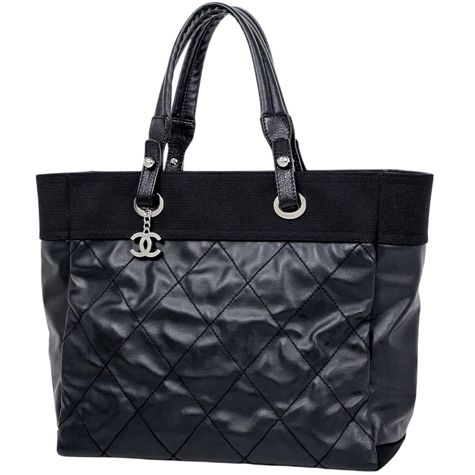 Canvas coated tote bag by Chanel: Canvas coated tote bag by Chanel Canvas coated tote bag by Chanel, featuring black coated canvas material and a compact size of 30cm x 35cm x 15cm. This stylish tote boasts a classic design that's per