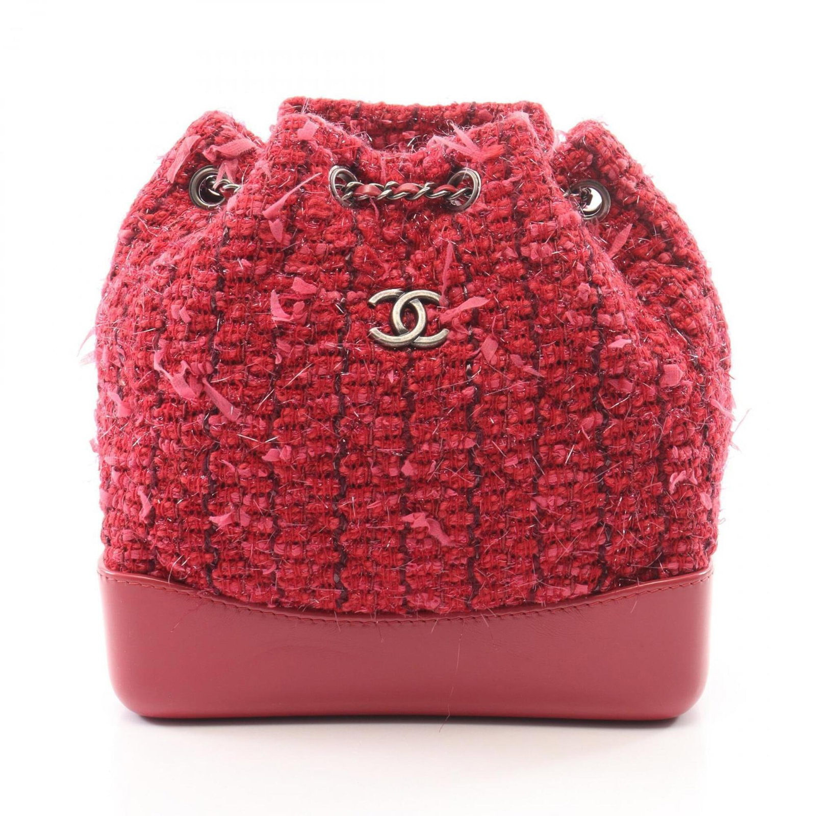 Handbag Fabric Leather Chanel Backpack: Handbag Fabric Leather Chanel Backpack This pink leather backpack features a unique fabric and leather design, making it a stylish accessory for women. Measuring 21cm x 22cm x 9cm, it offers a