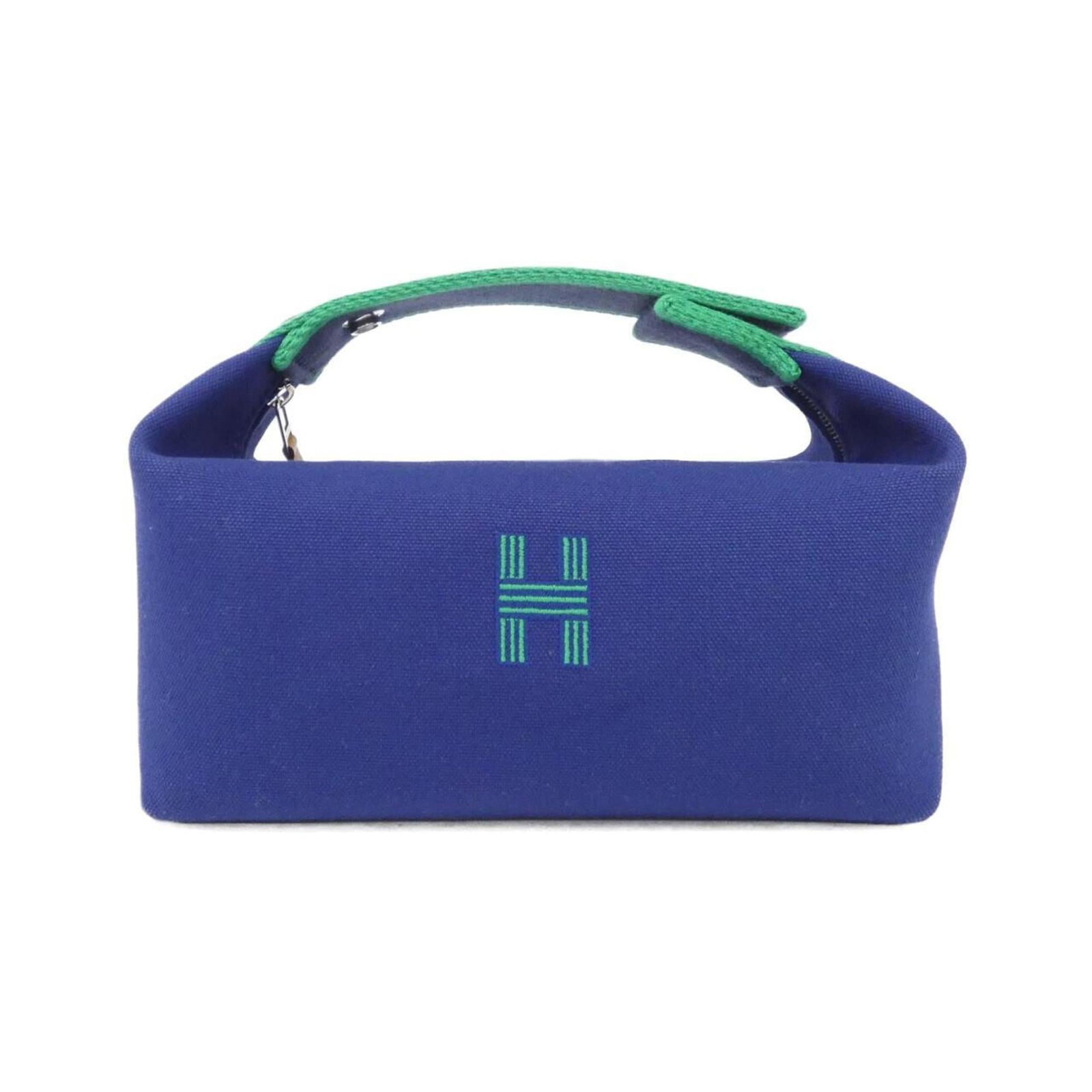 Canvas Pouch Hermes: Canvas Pouch Hermes Canvas Pouch by Hermes, featuring high-quality canvas material and silver hardware, measures 12cm x 21cm x 14cm. The classic design of this pouch makes it a versatile accessory for