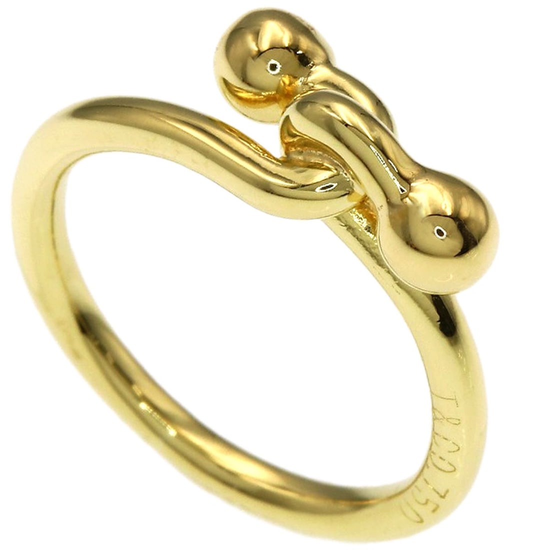 Love Knot Gold K18 Ring by Tiffany & Co: Love Knot Gold K18 Ring by Tiffany & Co K18 Yellow Gold Love Knot Ring by Tiffany & Co. features a delicate gold design with no main stone, making it a sleek and understated accessory. Crafted from