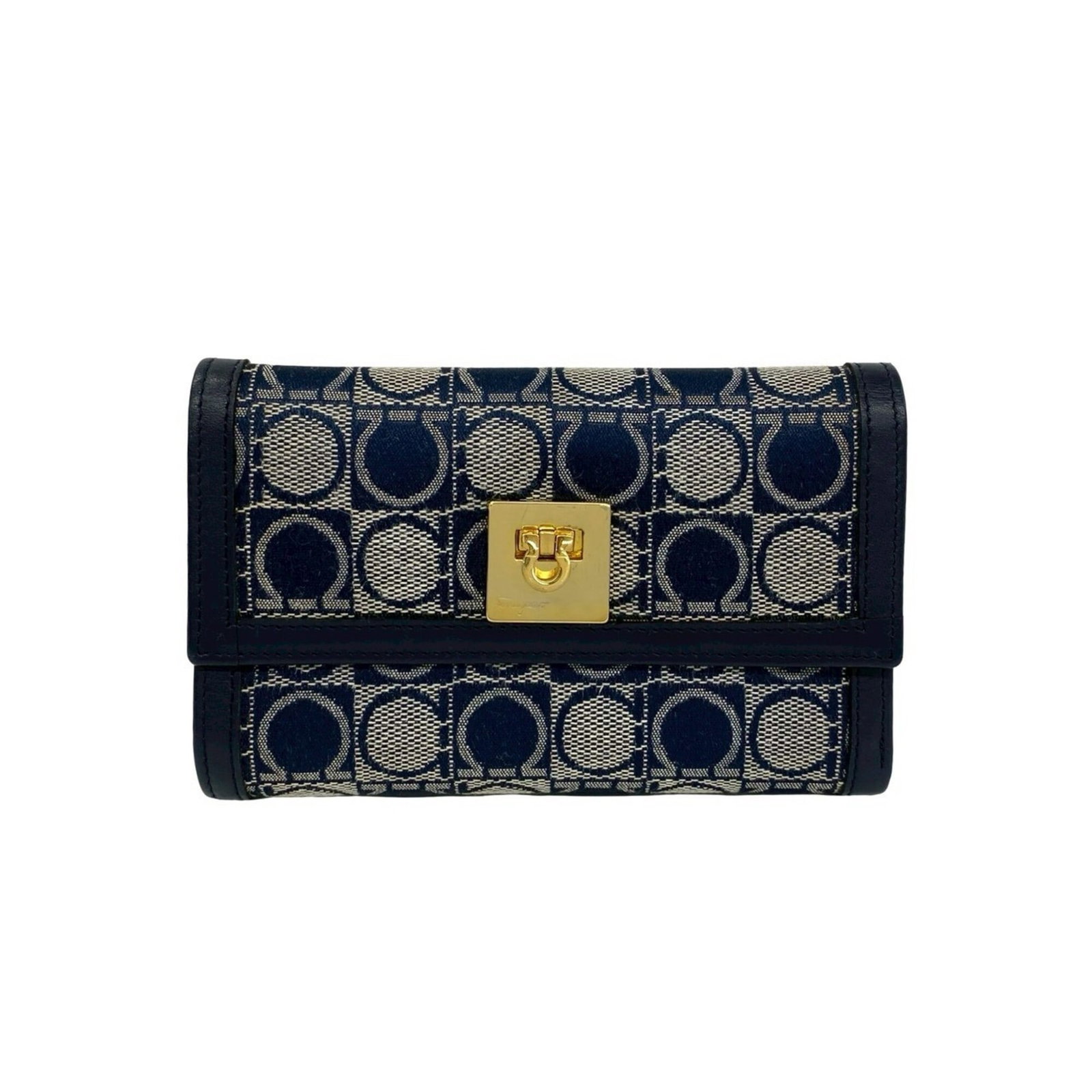 Salvatore Ferragamo Canvas Leather Tri Fold Wallet: Salvatore Ferragamo Canvas Leather Tri Fold Wallet Canvas and leather come together in a sleek tri-fold wallet from Salvatore Ferragamo, featuring a classic navy color. This versatile accessory measur