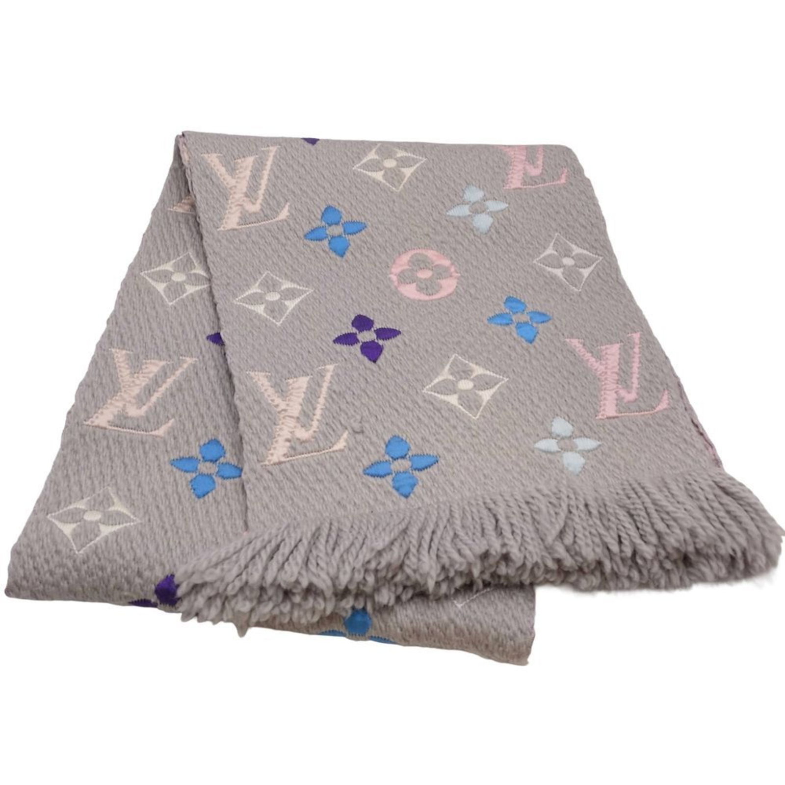 Silk stole by Louis Vuitton: Silk stole by Louis Vuitton Silk stole by Louis Vuitton in gray and pink hues, featuring a unique blend of wool and silk materials. Measuring 1.63m x 31cm, it boasts an elegant size that adds sophisti