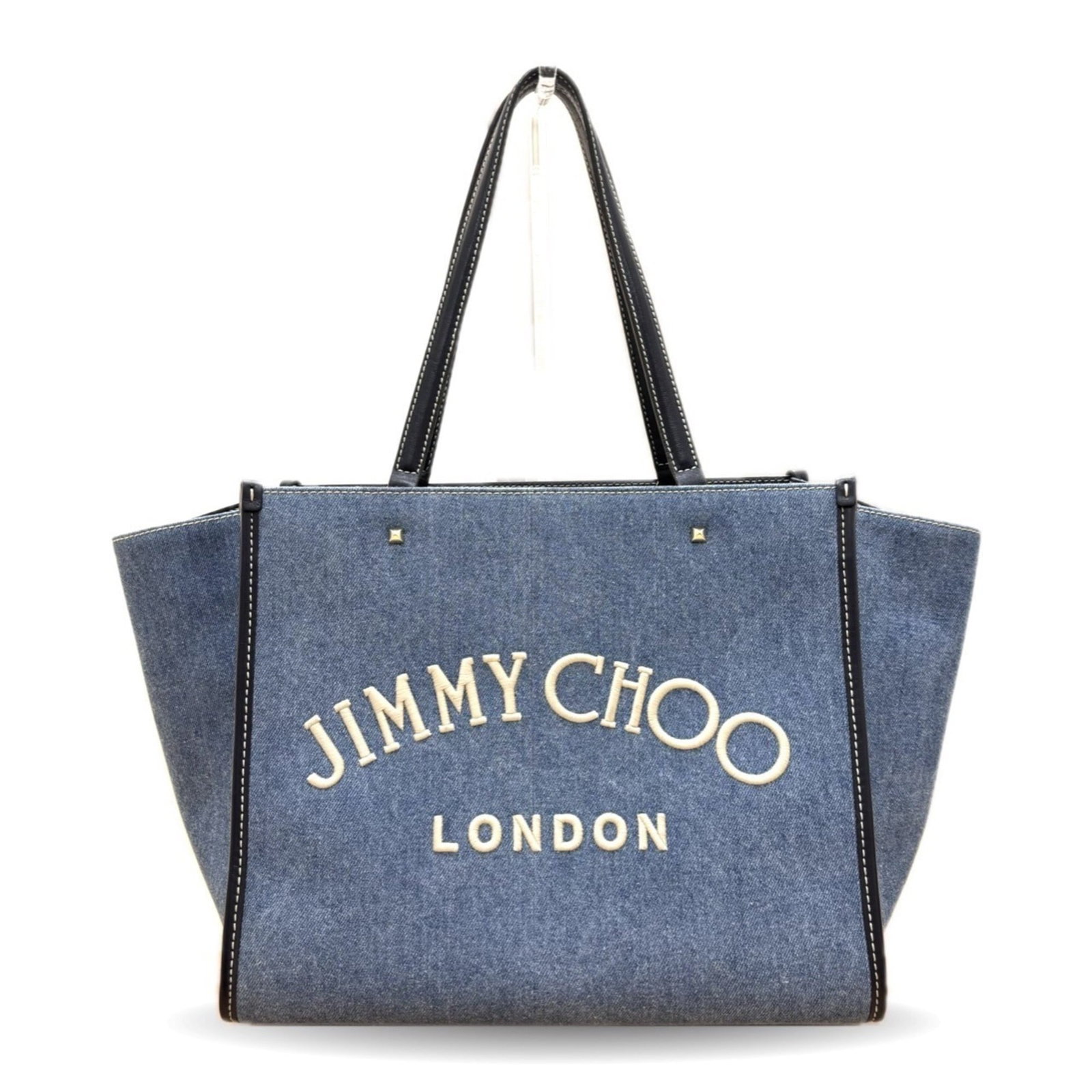 Jimmy Choo tote bag denim leather: Jimmy Choo tote bag denim leather Denim and leather come together in the Jimmy Choo tote bag, a stylish and versatile accessory. Measuring 27.5cm x 50cm x 20cm, it features a signature that bears a