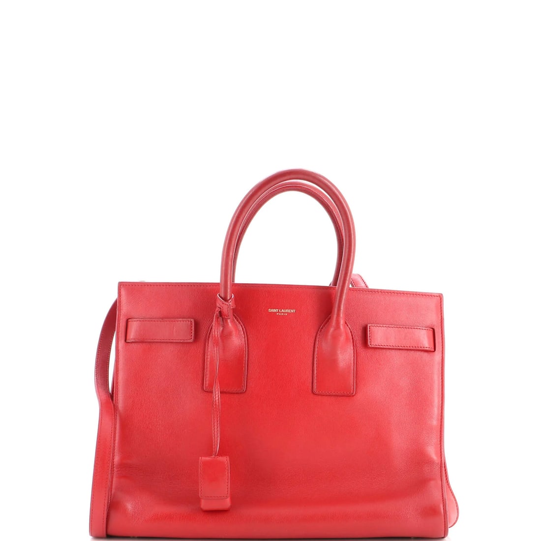 Saint Laurent Sac de Jour Bag Leather Small: Saint Laurent Sac de Jour Bag Leather Small Small Saint Laurent Sac de Jour Bag in Red Leather. This iconic bag features top handle, gold hardware, and a clochette lock with strap for added security.