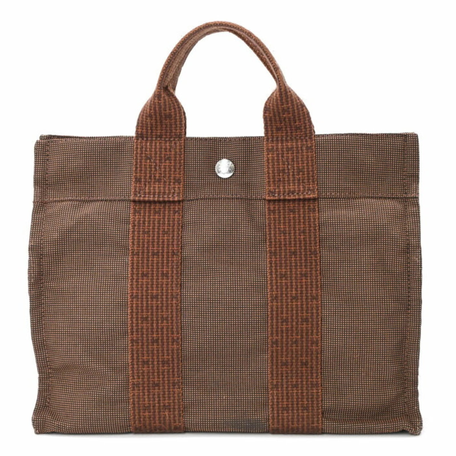 Hermes handbag nylon canvas tote bag: Hermes handbag nylon canvas tote bag Nylon canvas tote bag from Hermes, featuring a classic brown color and compact size. This versatile bag measures 23cm x 30cm x 9cm, making it perfect for daily use