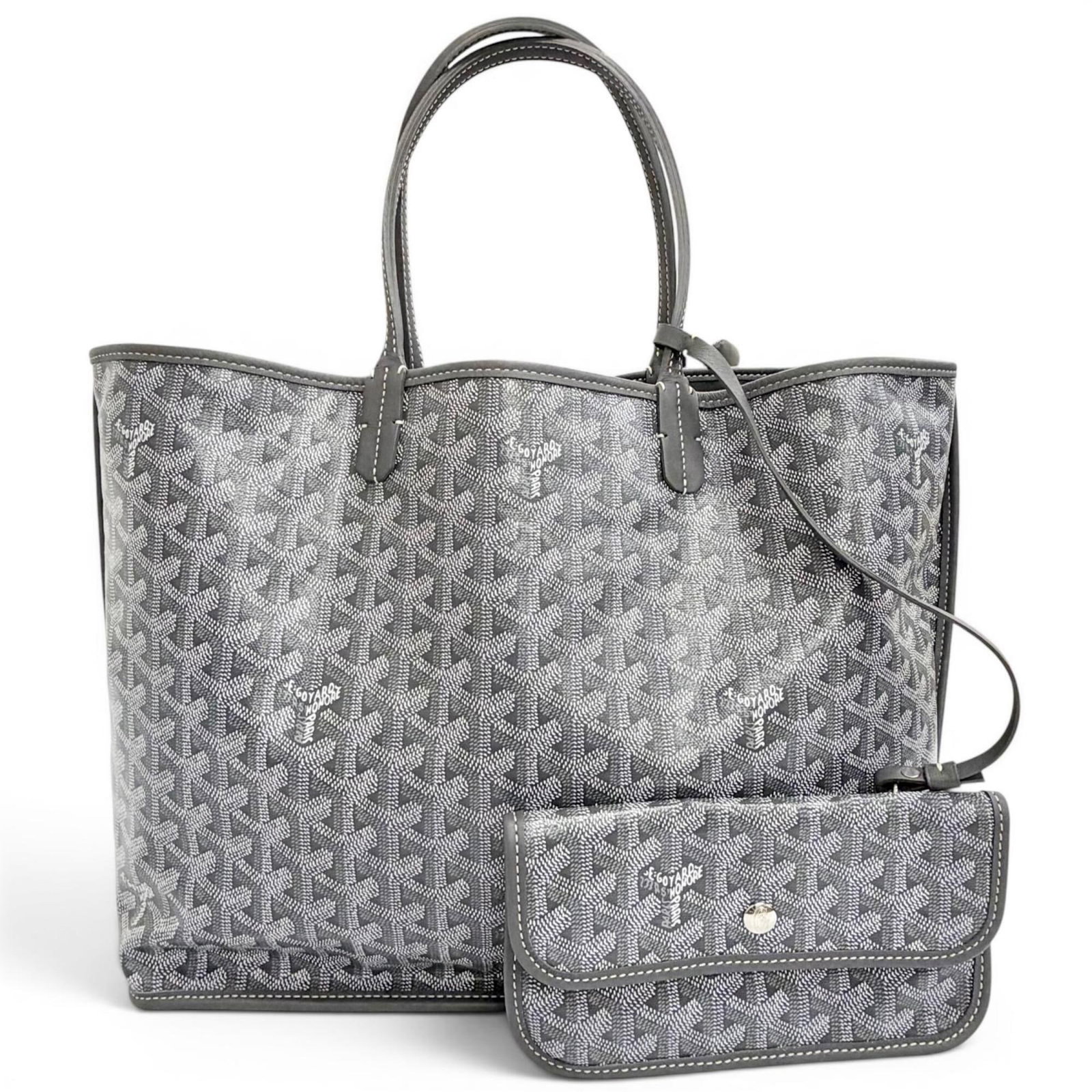 Canvas leather tote bag pouch goyard: Canvas leather tote bag pouch goyard Gray canvas and leather Goyard tote bag pouch, measuring 28cm x 46cm x 15cm. This French-made bag features a classic design with high-quality materials that will