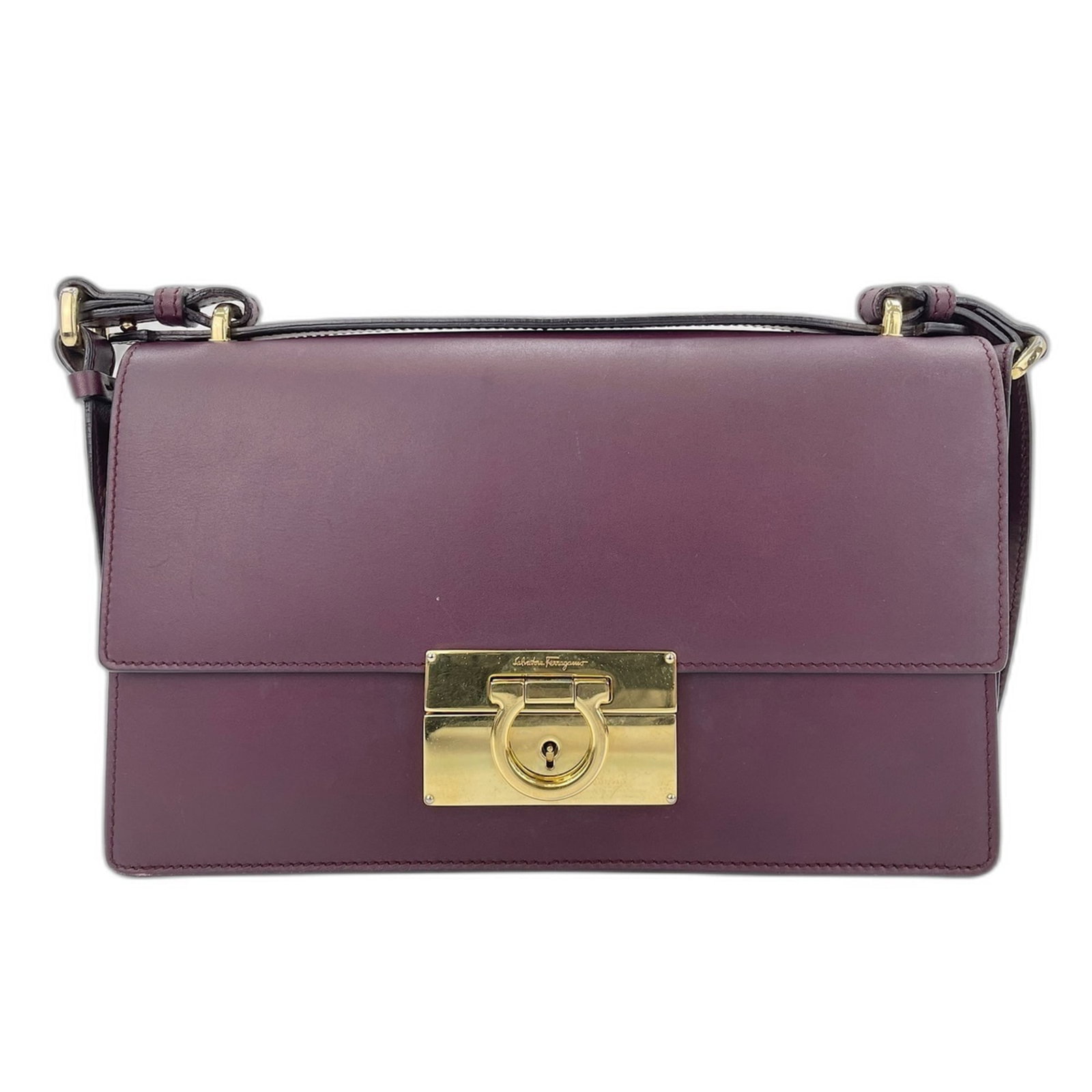 Shoulder bag leather by Salvatore Ferragamo: Shoulder bag leather by Salvatore Ferragamo The Salvatore Ferragamo Gancini shoulder bag is crafted from rich, luxurious leather in a beautiful wine color. Measuring just 14cm x 24cm x 6cm, it feature