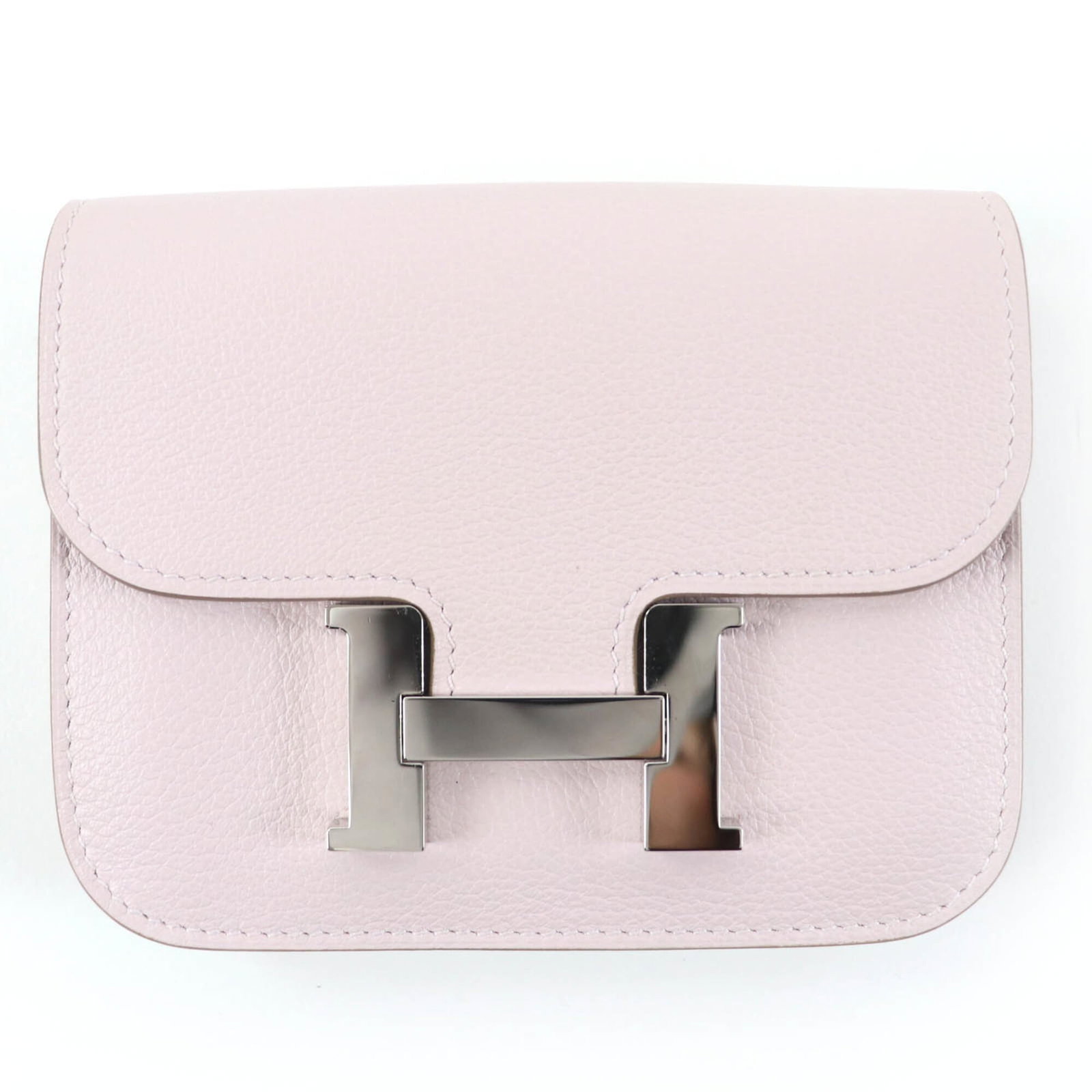 Fanny Pack by Hermes: Fanny Pack by Hermes Silver hardware adds a touch of elegance to this compact fanny pack from Hermes, measuring 10cm x 12.5cm in size. Made in France, it features a timeless design that complements an
