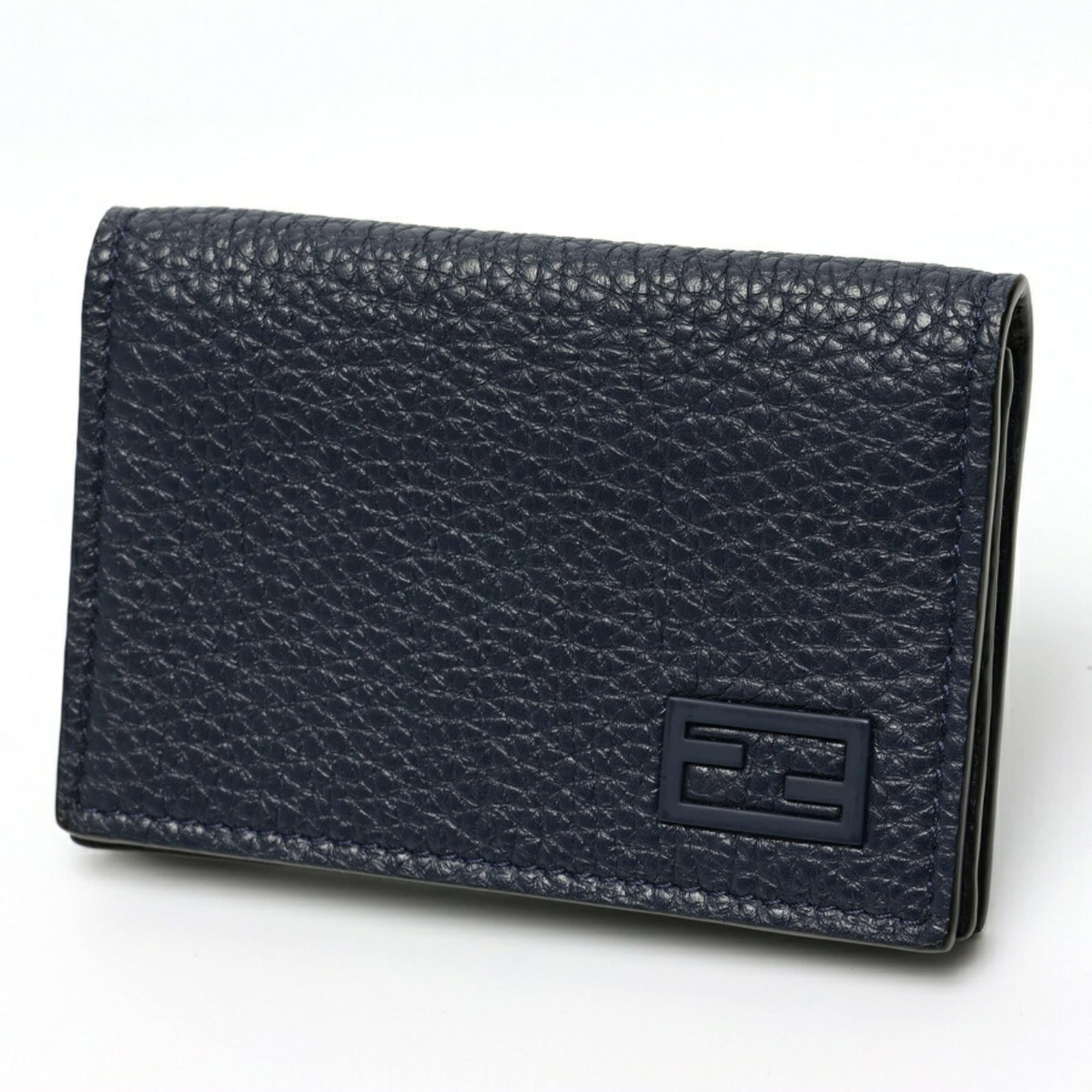 Fendi Card Case Leather: Fendi Card Case Leather The Fendi Card Case Leather is a sleek and sophisticated accessory crafted from high-quality Italian leather. Measuring 7cm x 11cm x 1.5cm, it features a classic design with a