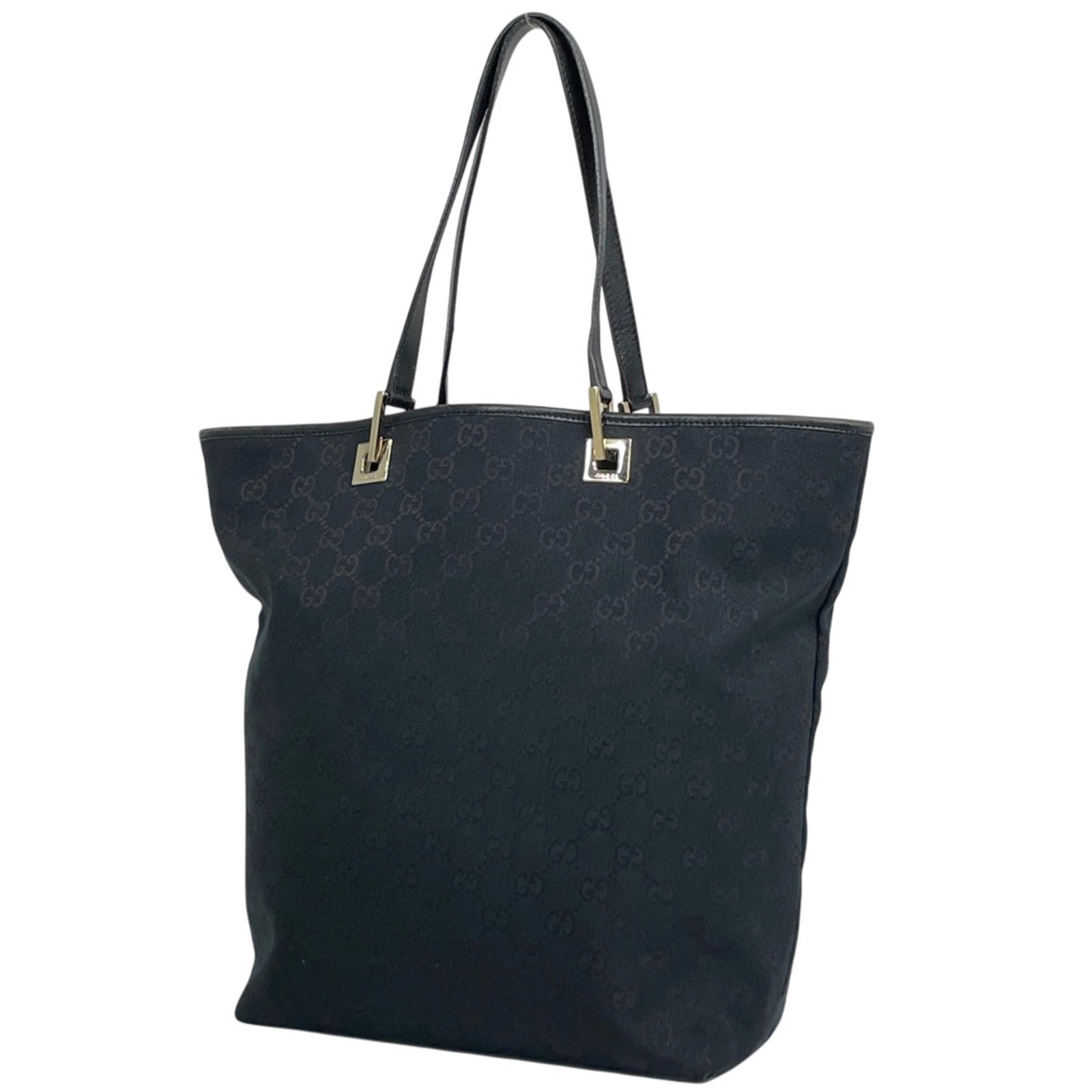 Canvas bag Gg by Gucci: Canvas bag Gg by Gucci GG canvas tote bag by Gucci, featuring the iconic interlocking GG logo in black. Made from high-quality canvas material, this stylish bag measures 32cm x 24cm x 12cm and is perf