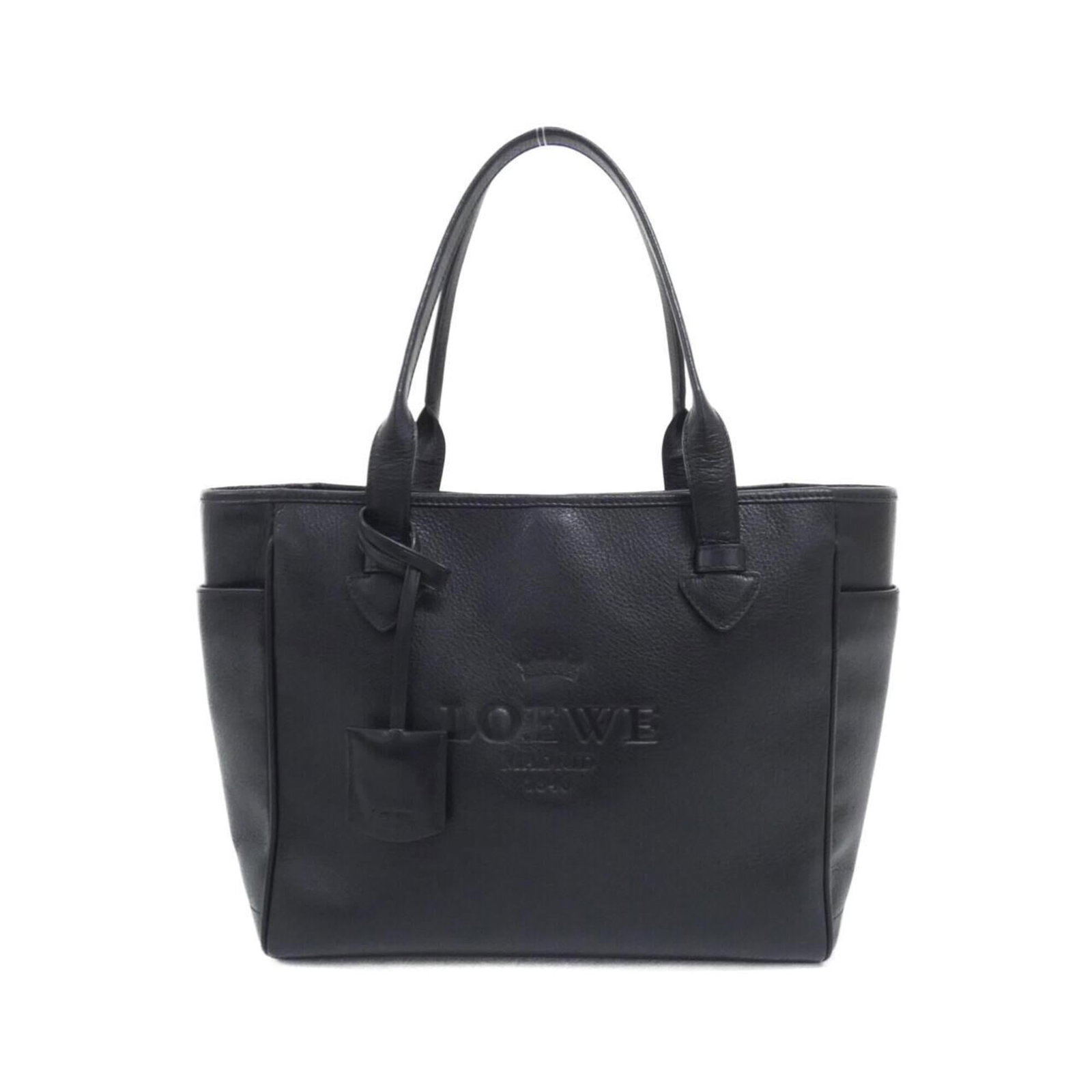 Handbag by Loewe: Handbag by Loewe Black Loewe handbag with dimensions 25cm x 29cm x 12cm. This stylish bag features a sleek design and compact size, making it perfect for everyday use. The black color provides a