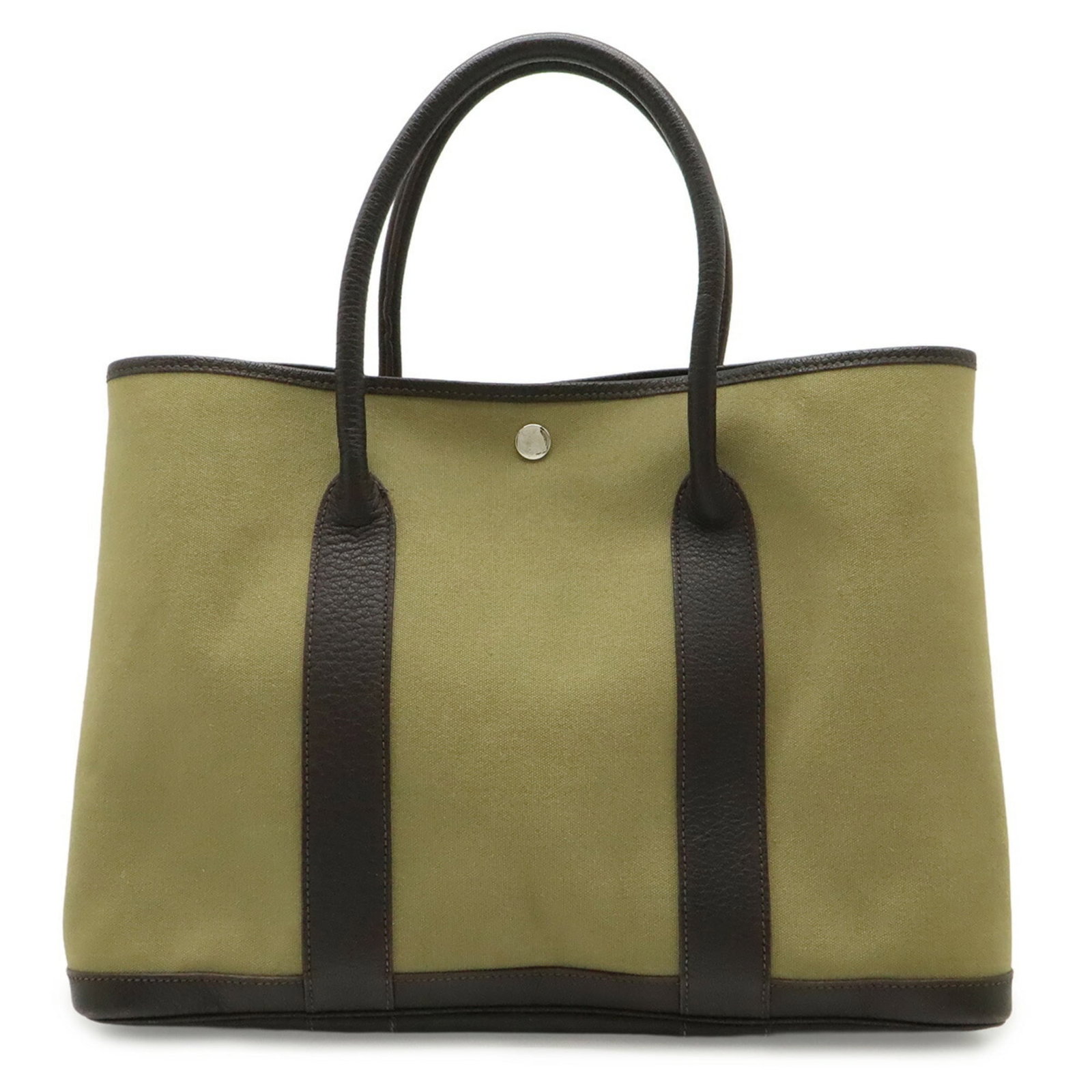 Canvas leather tote bag from Hermes: Canvas leather tote bag from Hermes Canvas leather tote bag from Hermes features dark brown and khaki colors, with a canvas and leather construction. Weighing in at 560g, the bag measures 26cm x