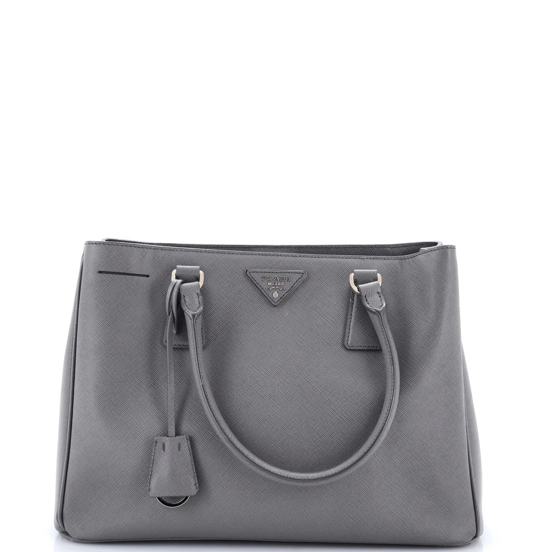 Gardener's medium Saffiano leather tote by Prada: Gardener's medium Saffiano leather tote by Prada Gray Saffiano leather medium tote by Prada, featuring a classic design with minor corner wear and edge wear. The exterior boasts a subtle gray color