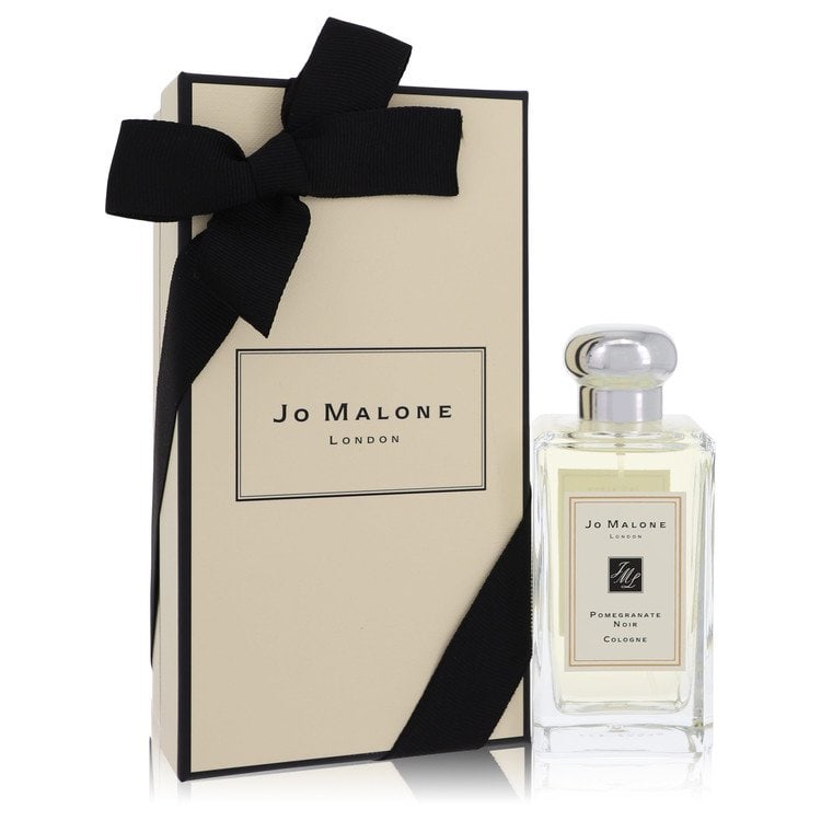 Jo Malone Pomegranate Noir by Jo Malone Cologne Spray (Unisex) 3.4 oz: Jo Malone Pomegranate Noir by Jo Malone Cologne Spray (Unisex) 3.4 oz Pomegranate Noir by Jo Malone is a rich and woody cologne with top notes of pomegranate, watermelon, rhubarb, plum, and raspberry.