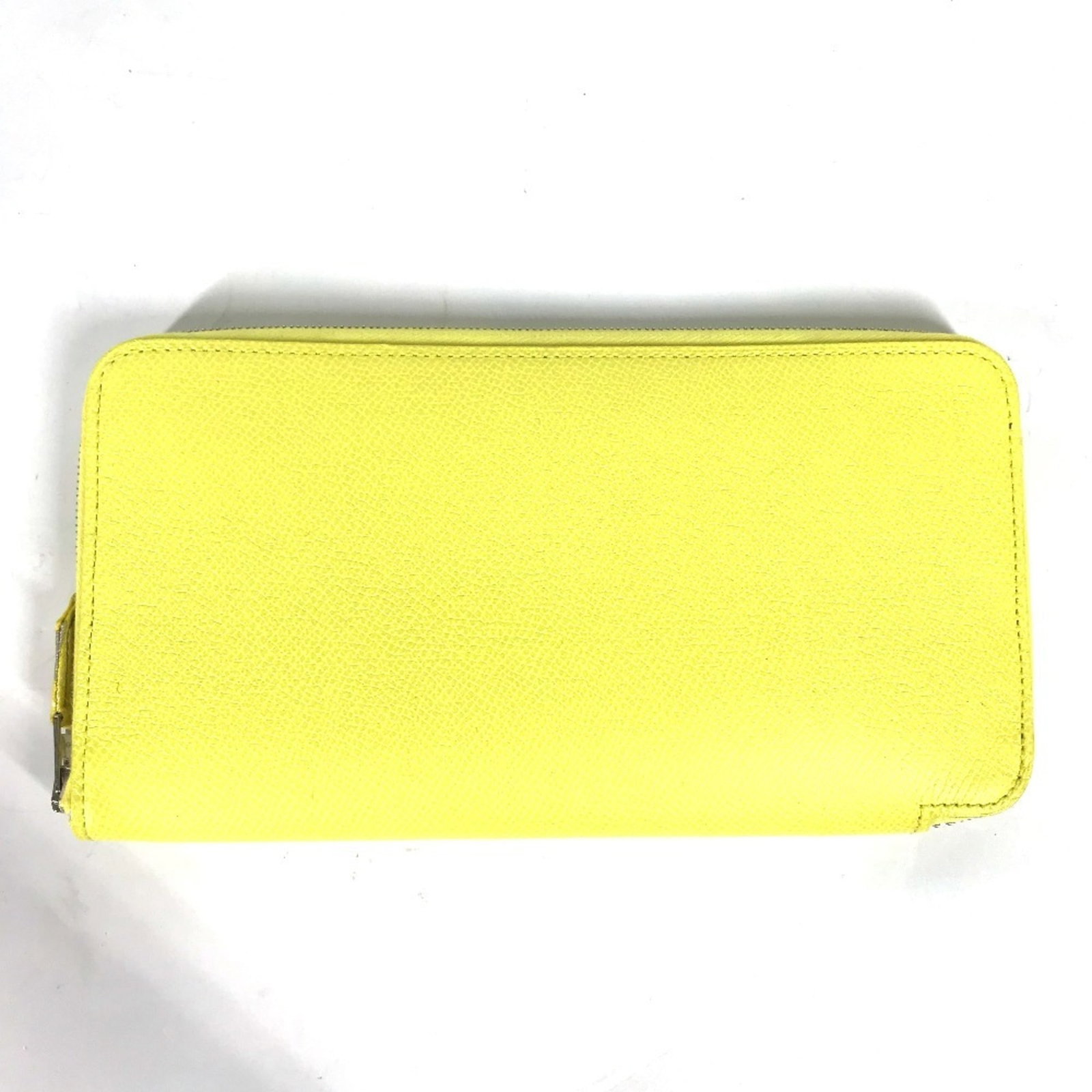 Epsom Leather Bi Fold Wallet Hermes: Epsom Leather Bi Fold Wallet Hermes Epsom Leather Bi Fold Wallet by Hermes features a vibrant yellow exterior, complemented by an inner card slot for organization. This long wallet measures 10.5cm x 1